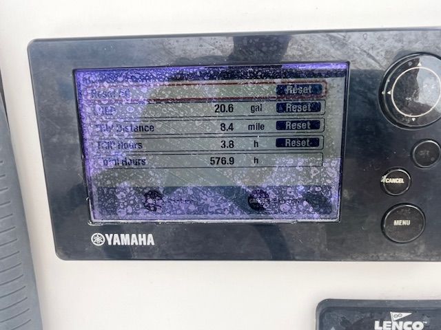 A Yamaha display shows fuel consumption, distance, and engine hours.