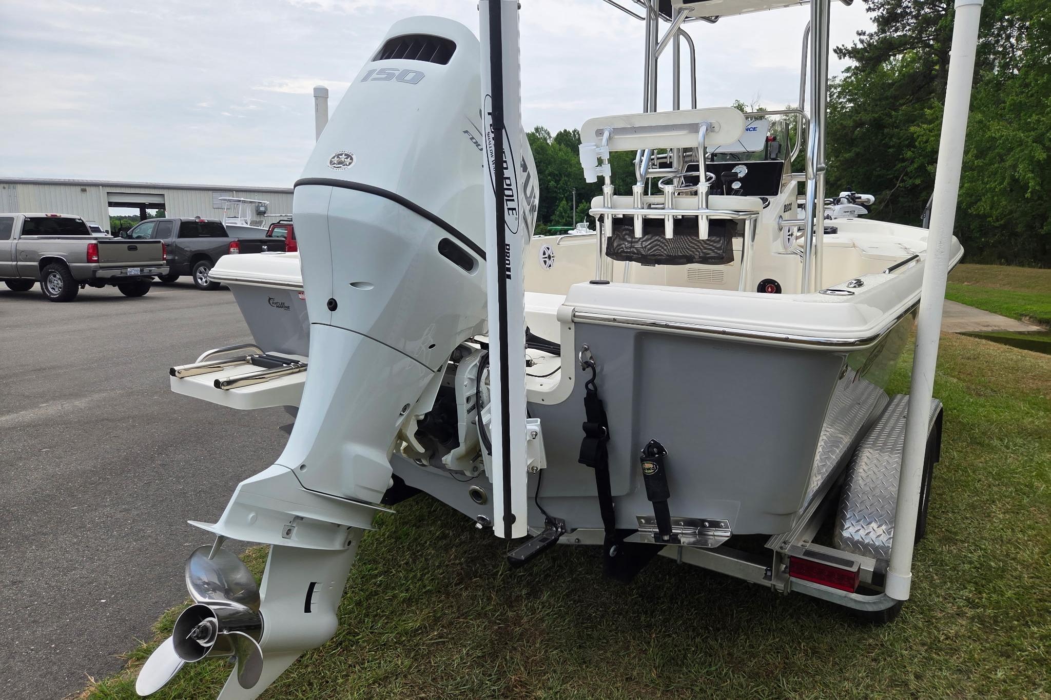 2023 Bulls Bay 2200 boat with powerful outboard motor on trailer, parked outdoors.