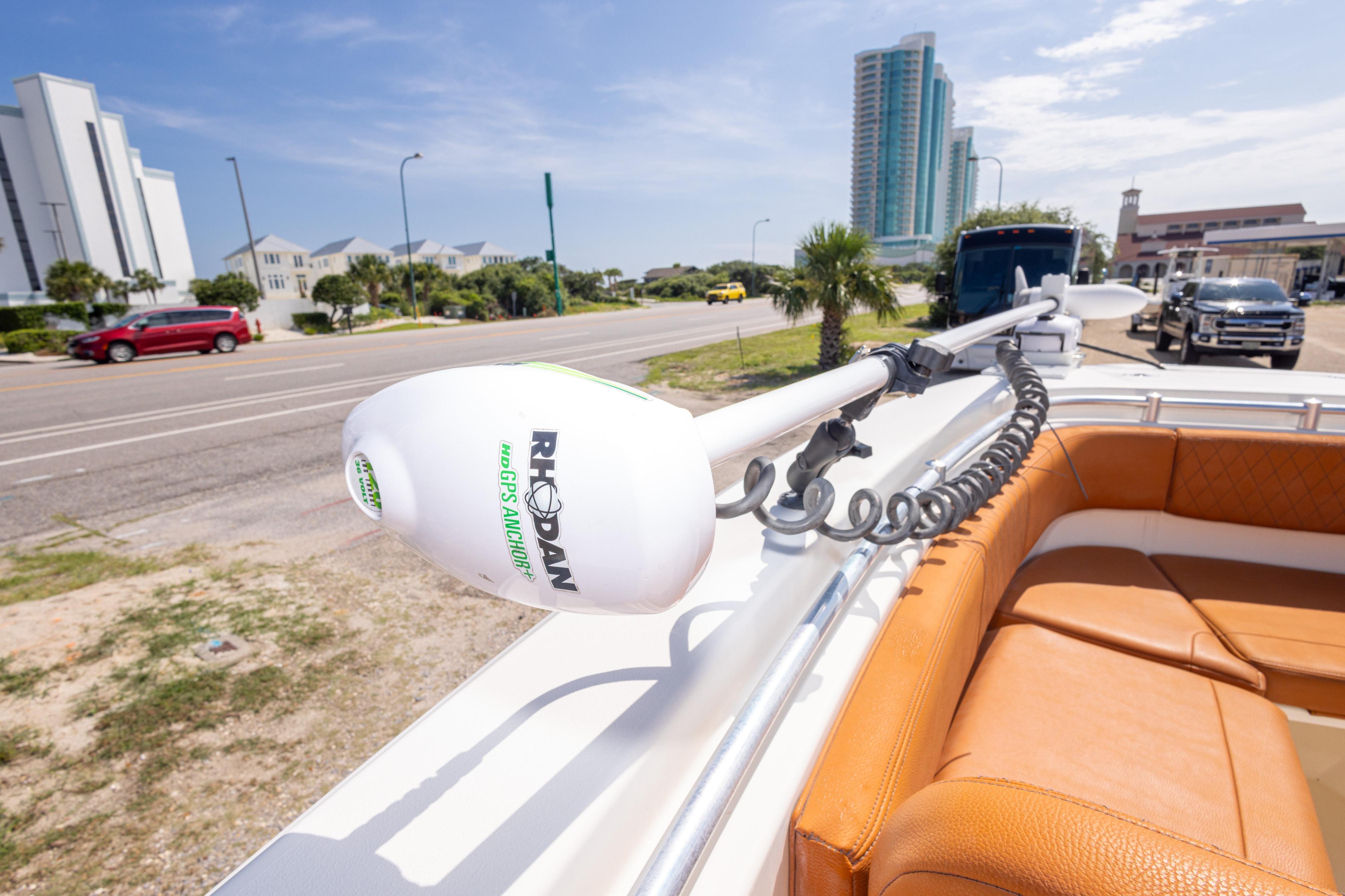 2017 Cobia 261 Center Console with Rhodan GPS Anchor, parked near a coastal road.