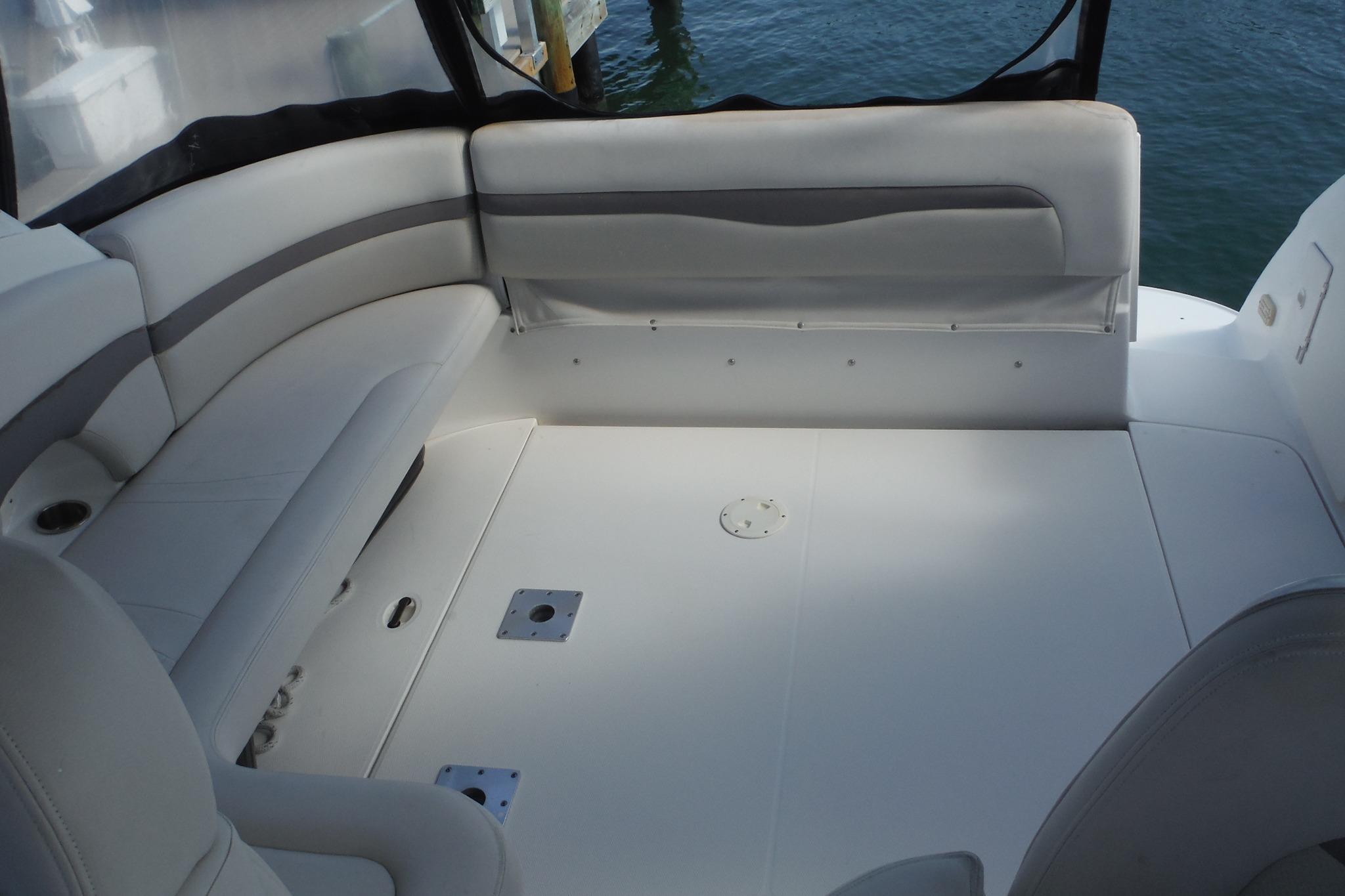 2005 Chaparral Signature 350 boat interior with white seating and spacious deck area.