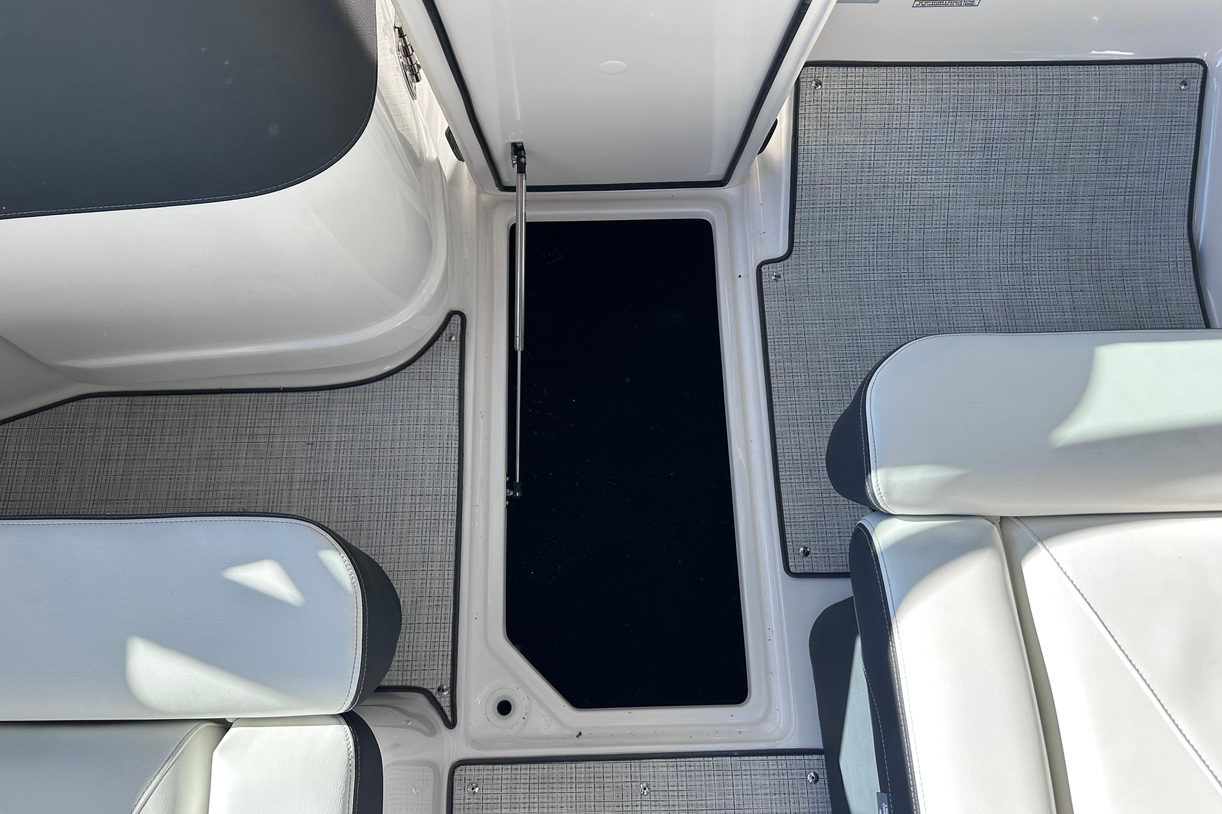 2026 Regal LX4 boat interior with sleek seating and textured flooring.