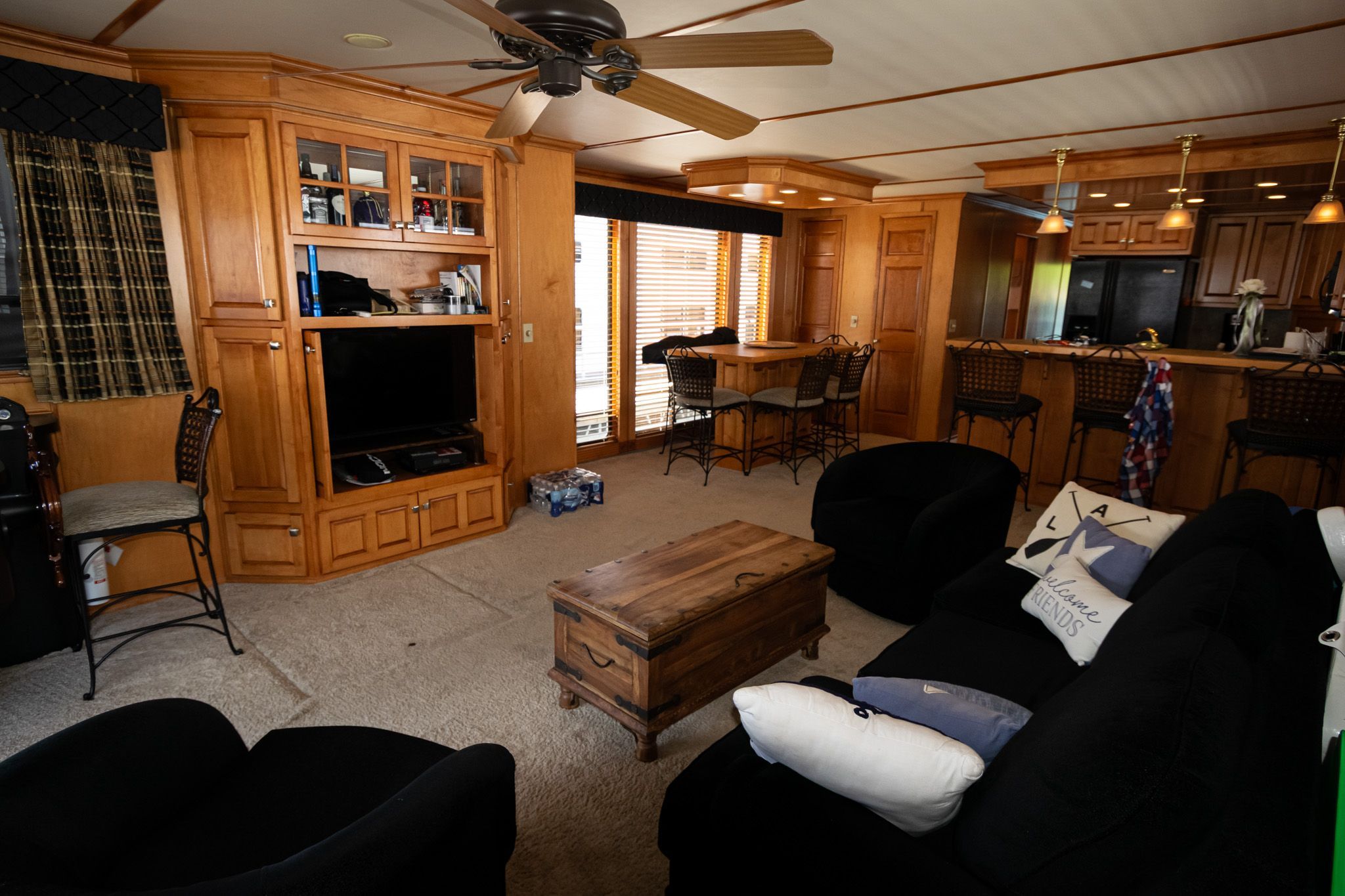 Interior of a 2003 Lakeview 16x70 houseboat with cozy living room.
