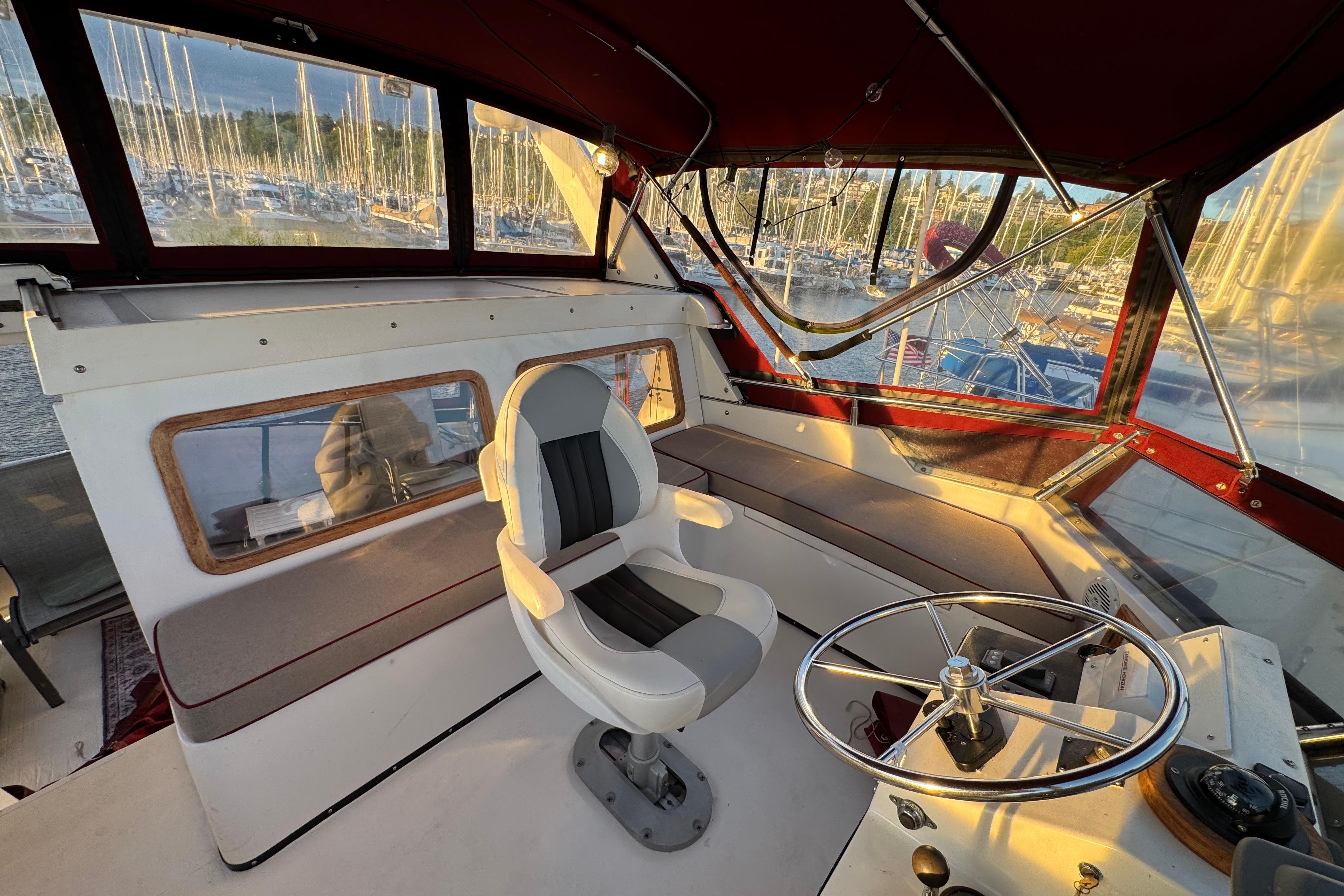 Interior of a 1987 President 37 yacht with helm and seating area.