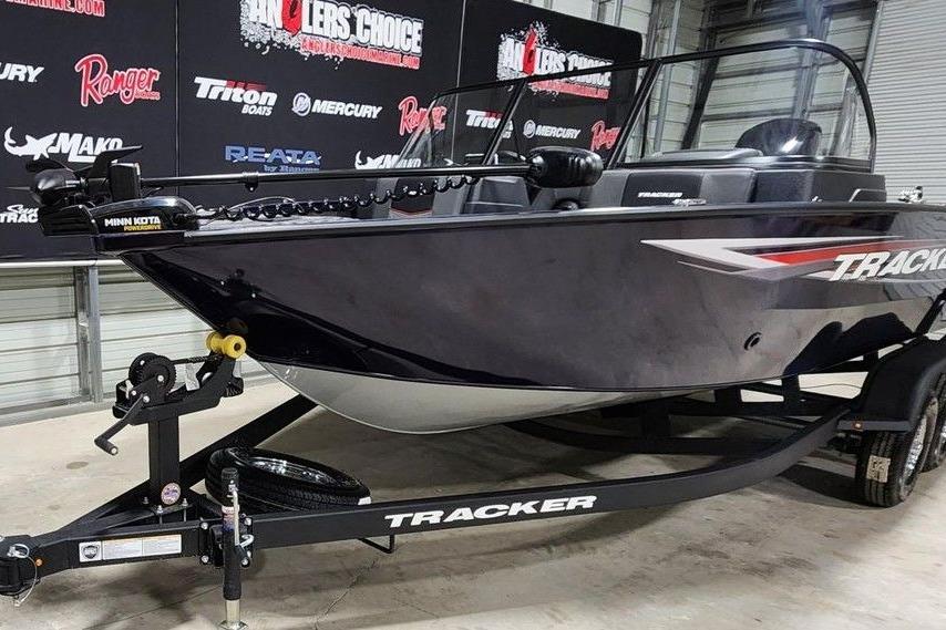 2026 Tracker Pro Guide V-175 Combo boat on trailer in showroom.