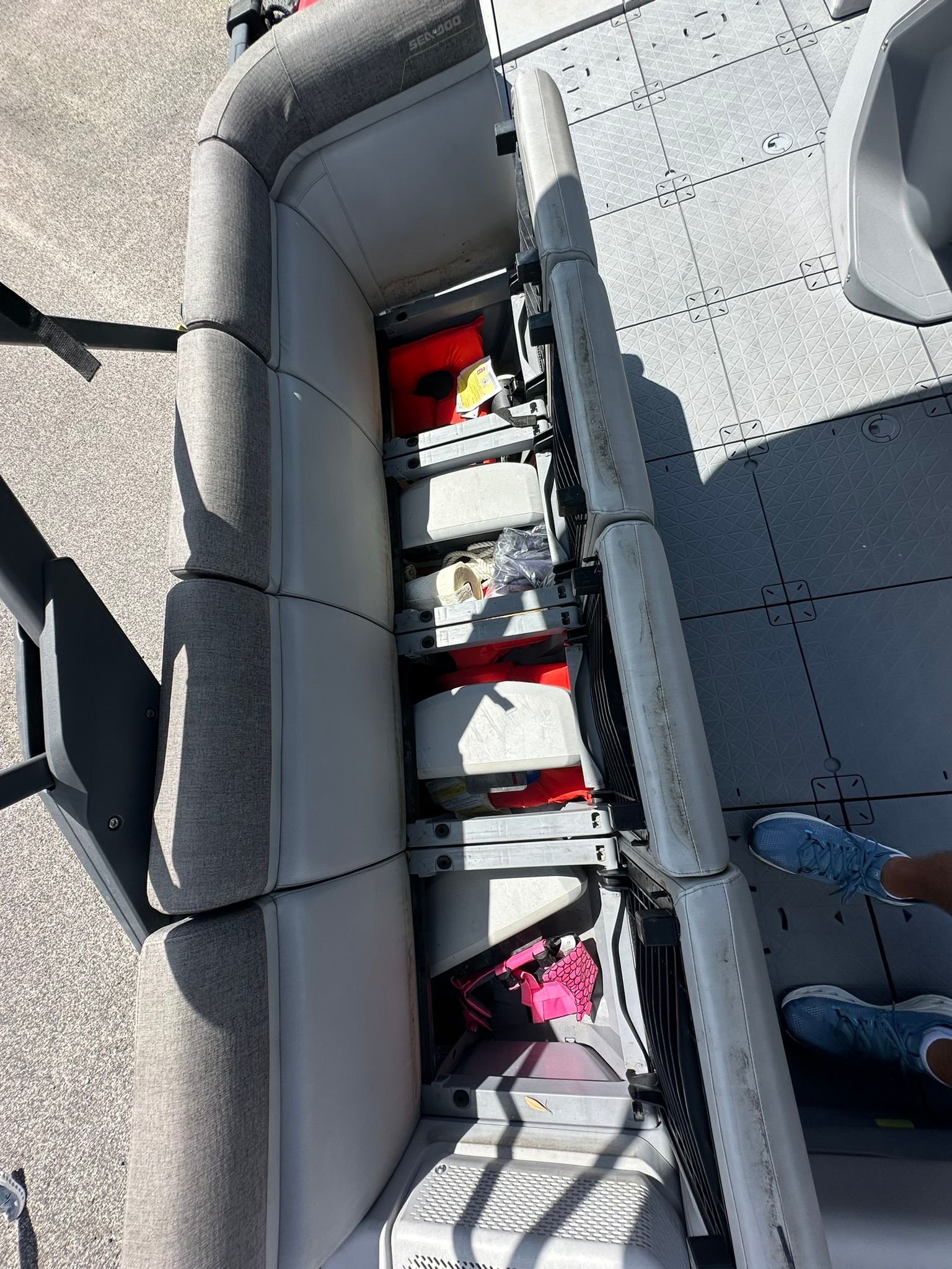 Interior view of a 2023 Sea-Doo 21 SWITCH SPORT with seating and storage underneath.