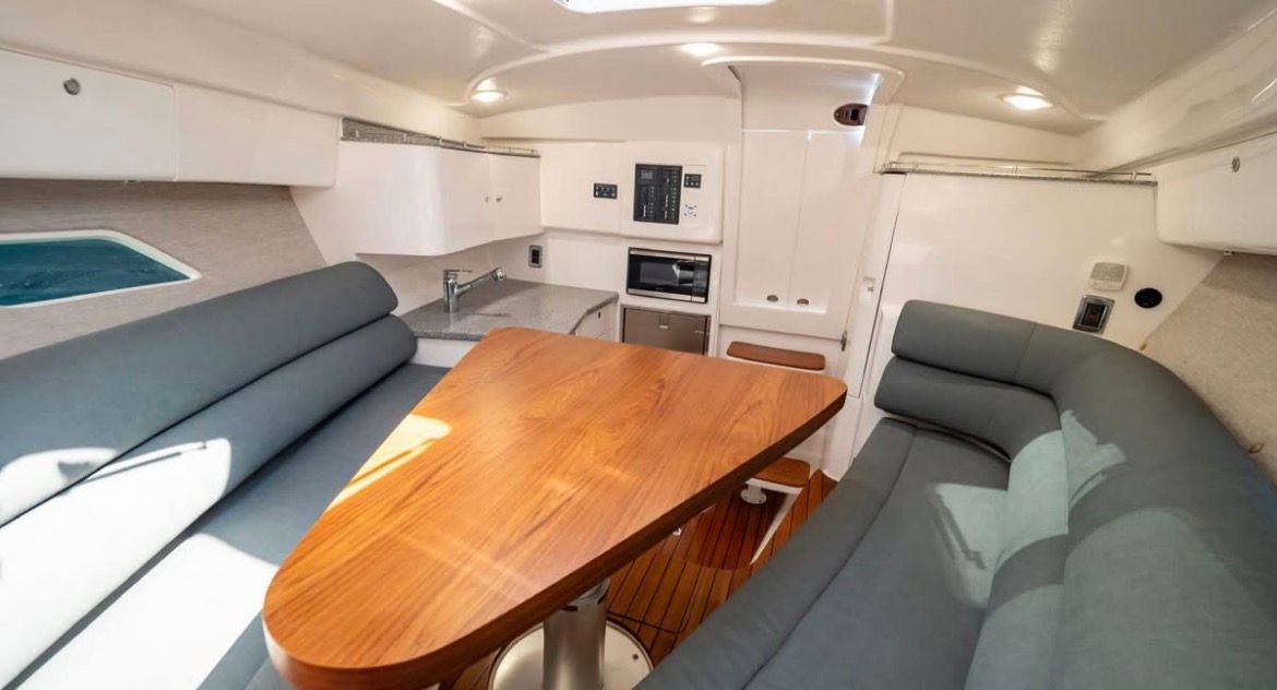 Interior of 2018 Intrepid 375 yacht with modern kitchen and seating area.