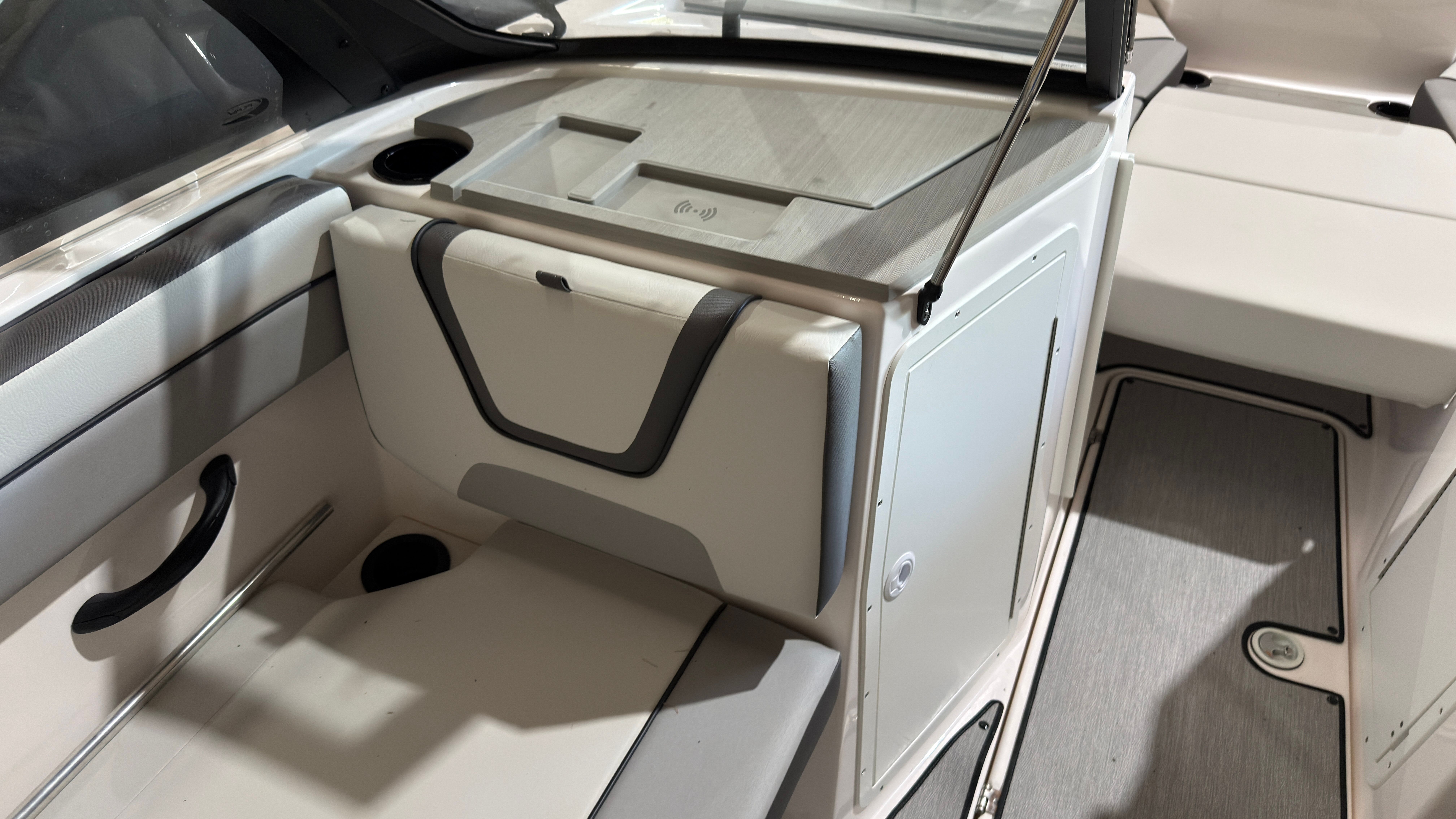 Interior of 2024 Yamaha Boats AR220 with seating and storage area.