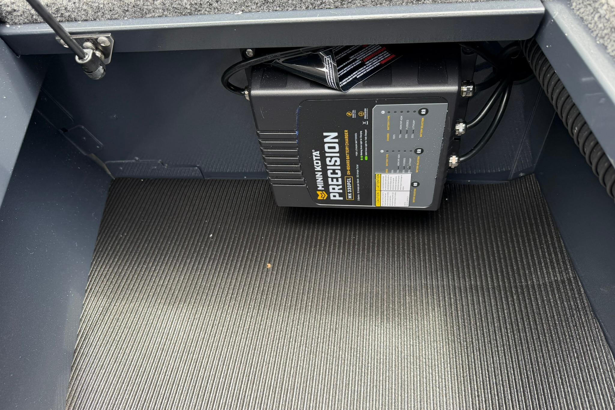 Battery charger installed in 2027 Lund 1675 Adventure Sport boat compartment.