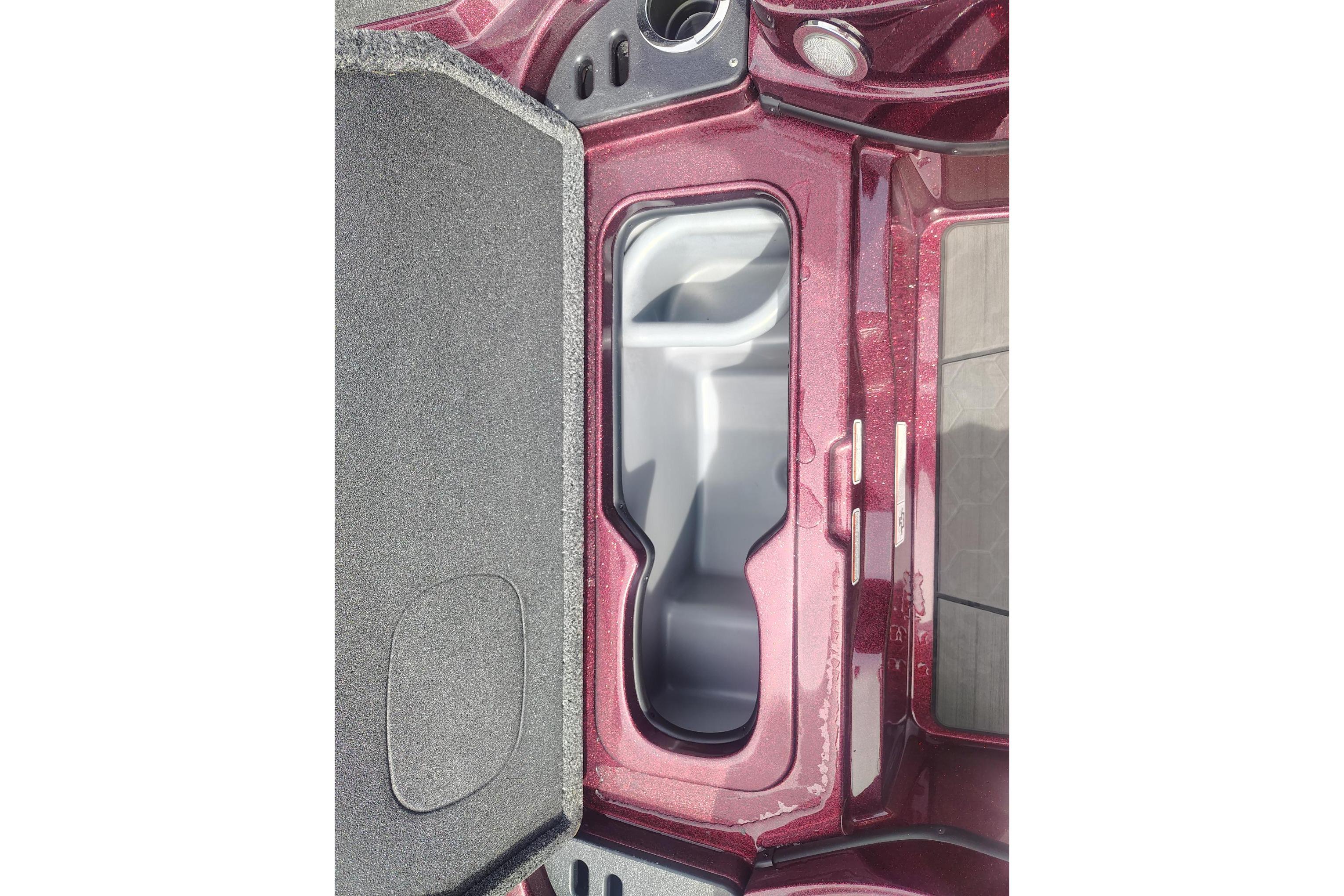 2024 Nitro Z21 XL boat interior storage compartment, maroon finish, open lid view.