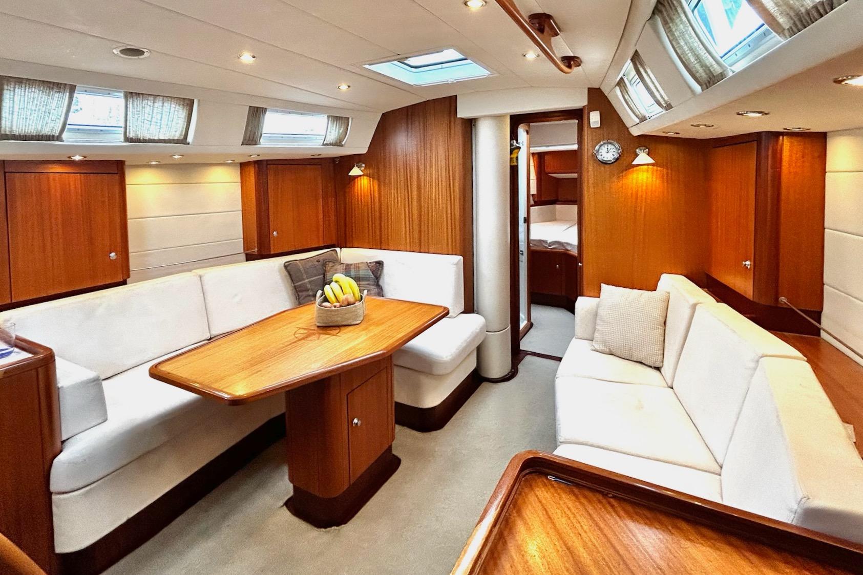 Luxurious 2006 Najad 440 CC yacht interior with elegant wood finish and comfortable seating.