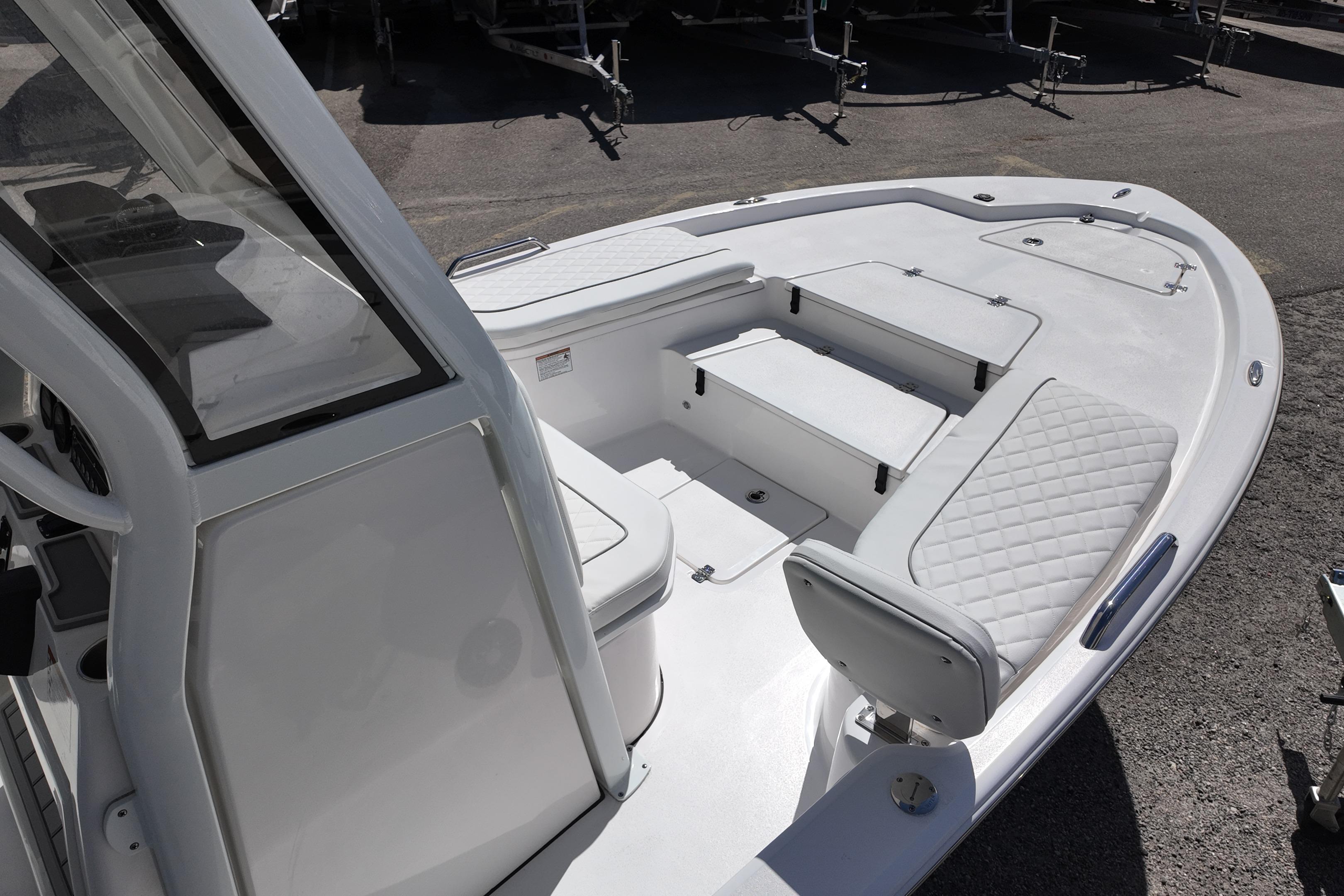 2026 Sea Fox 251 Bay Fox boat interior with white seating and storage compartments.