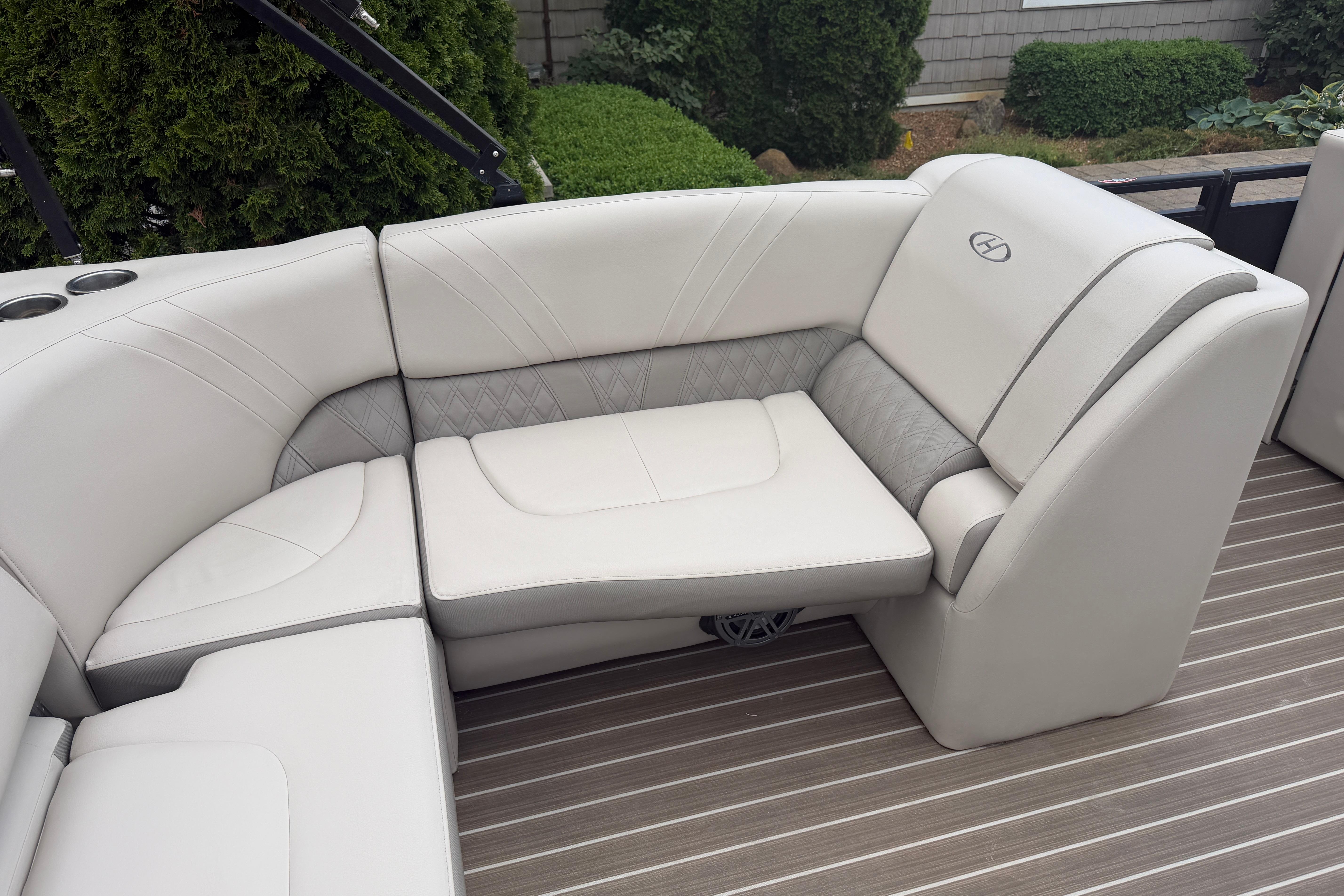 Luxurious seating on a 2019 Harris Solstice 240 pontoon boat, featuring elegant upholstery.