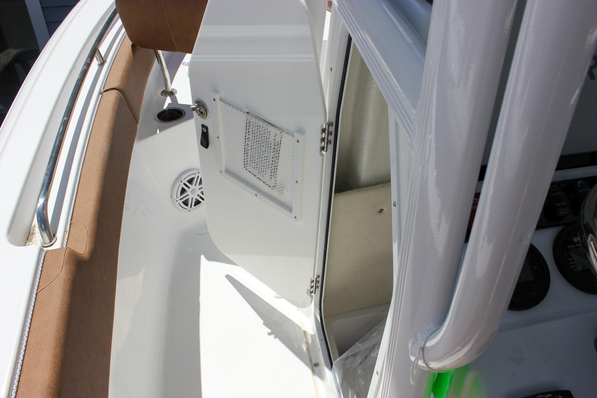2027 Sea Hunt Ultra 234 boat interior with open storage compartment and seating area.