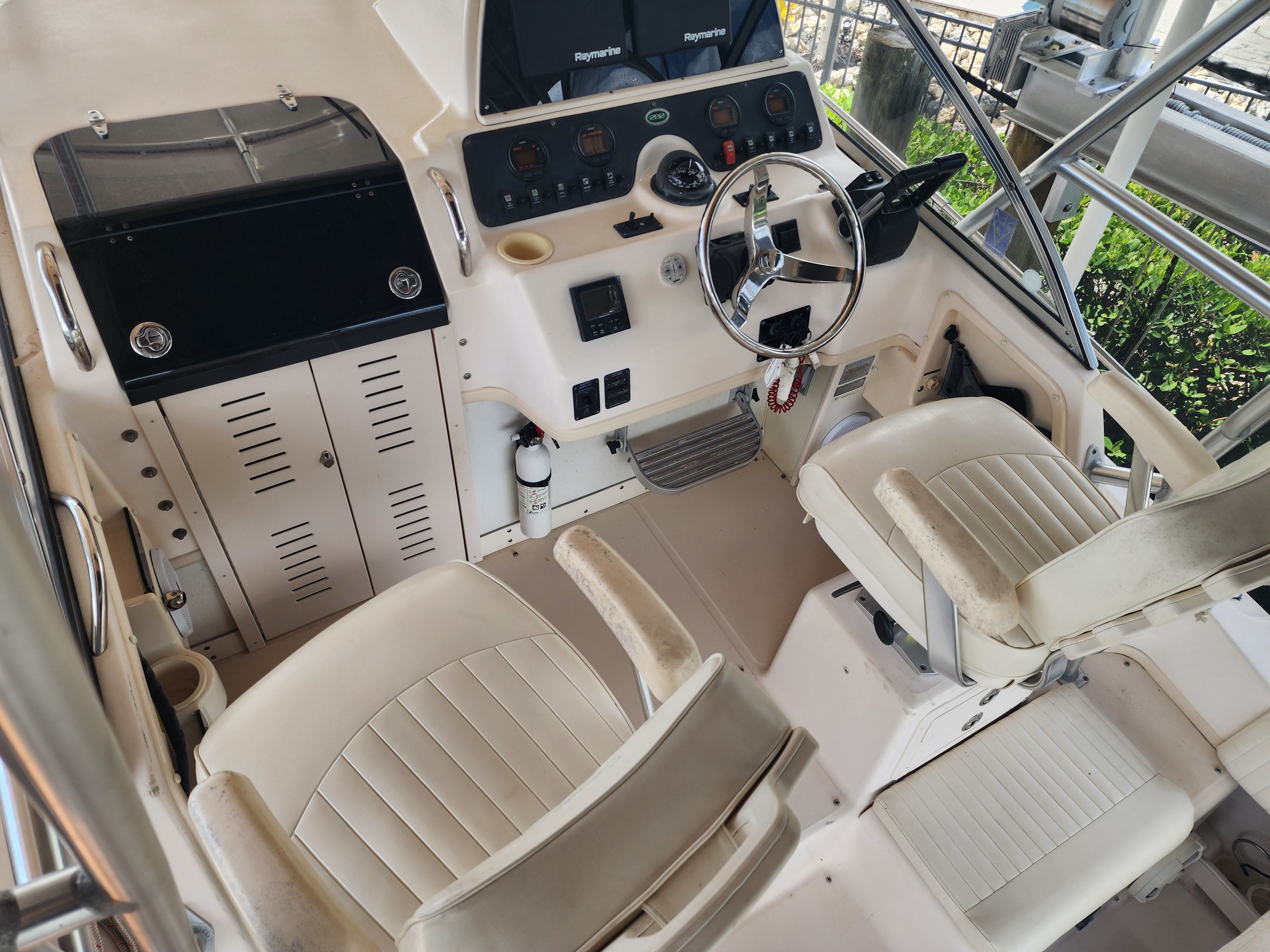 Interior of a 2005 Grady-White Sailfish 282 boat, helm station and seats.