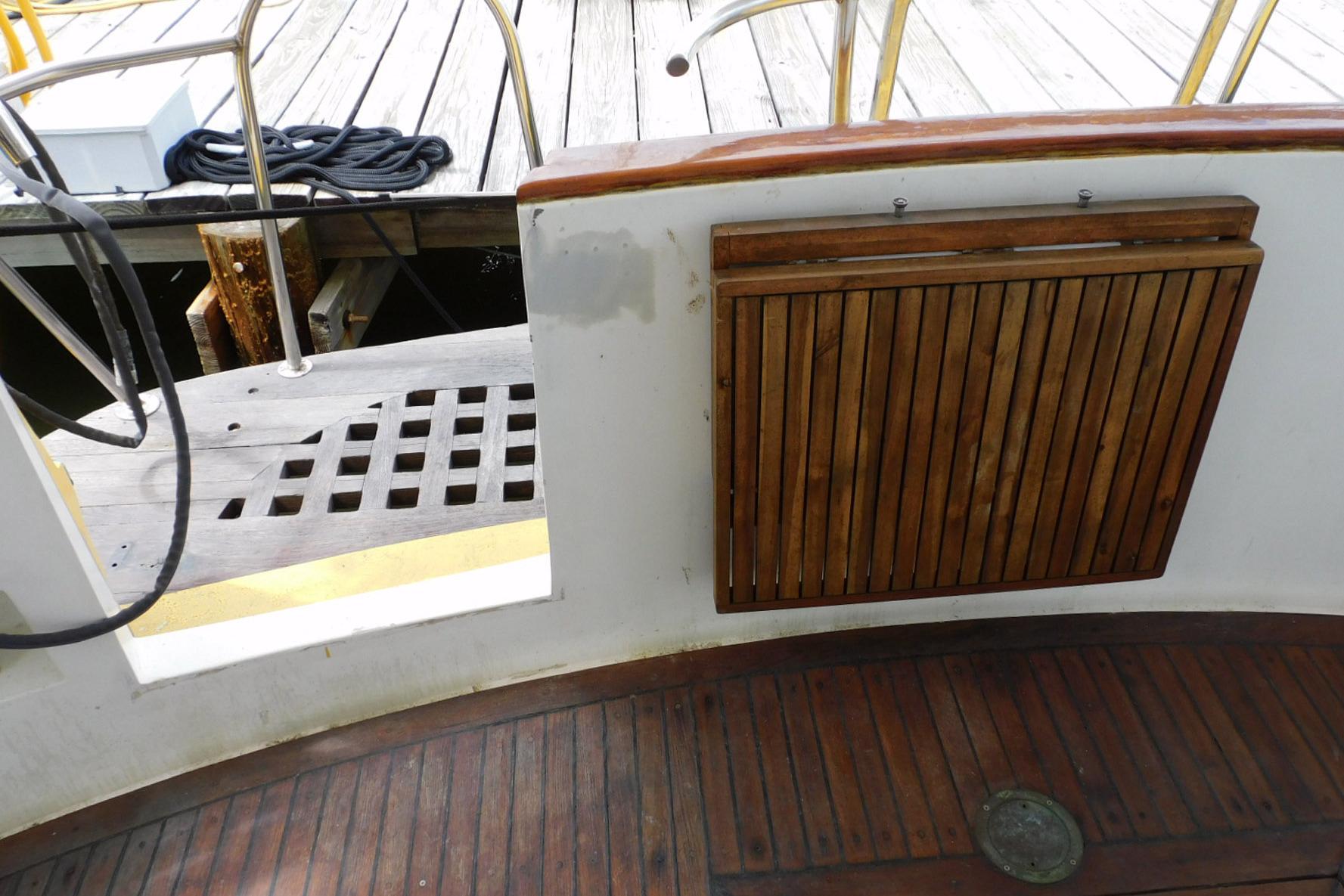 1988 Hans Christian 45 Independence Trawler deck with wooden details and dock view.