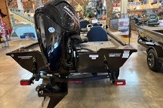 2026 Tracker Pro Team 175 boat displayed indoors, rear view with motor.