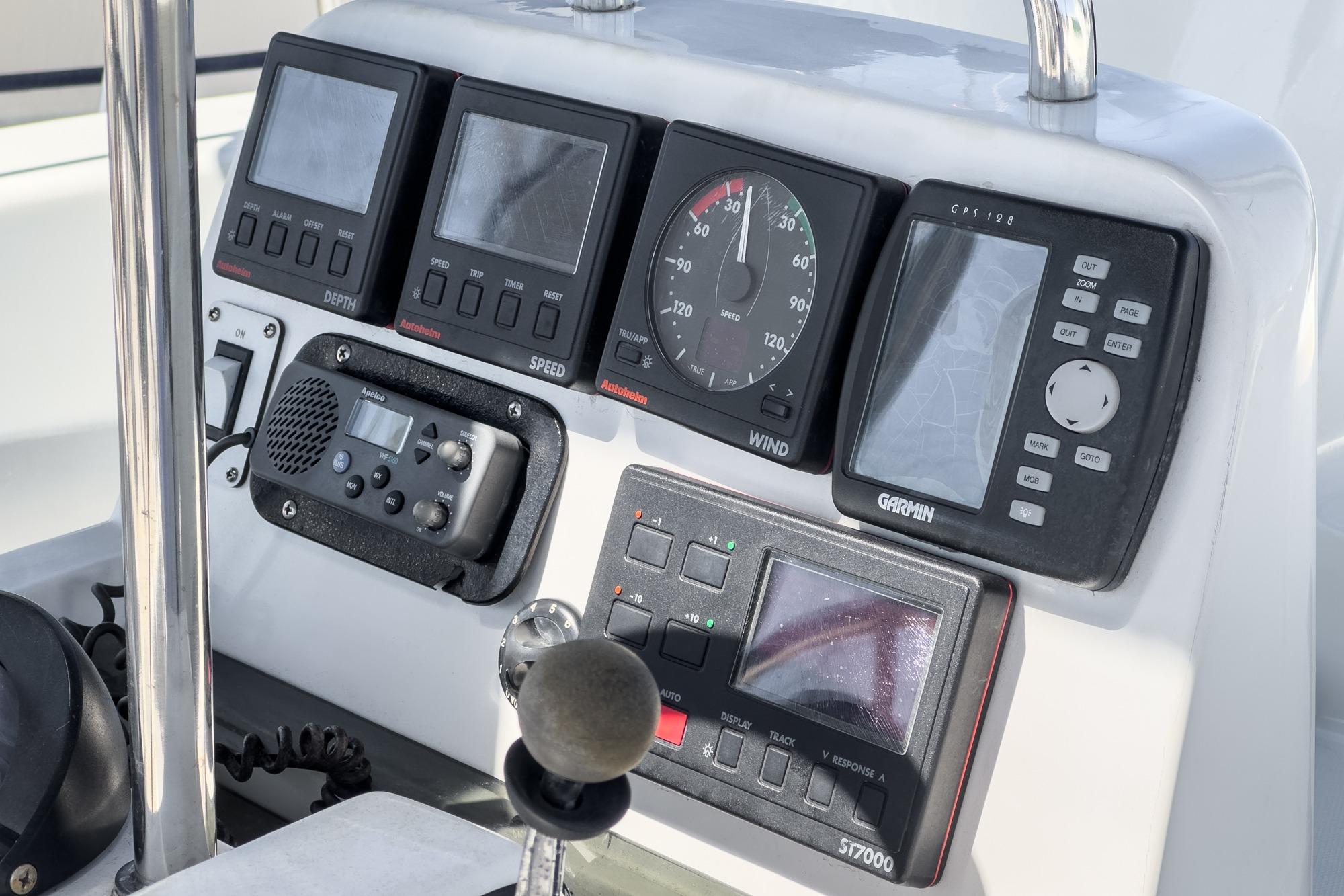 Control panel of a 1996 Hunter 376 sailboat with navigation instruments and displays.