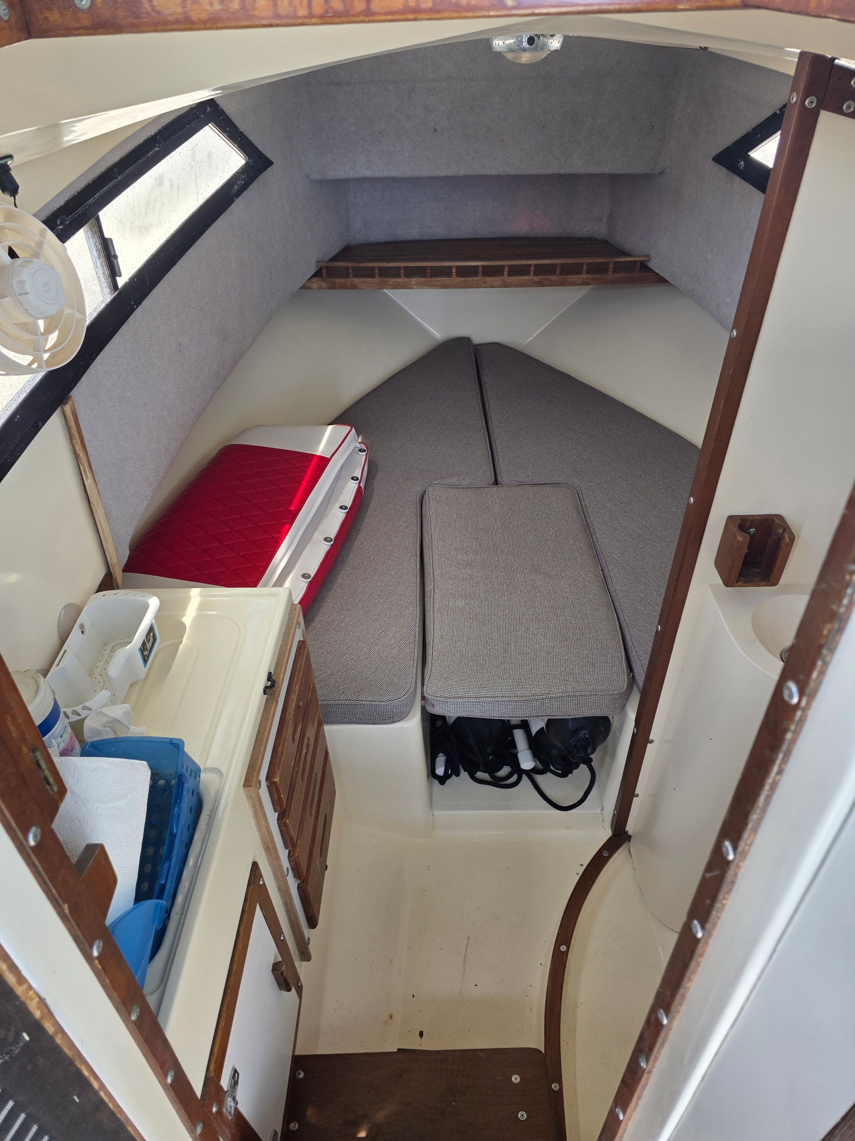 Interior of a 1987 Mako 248 WAC with sleeping area and storage.