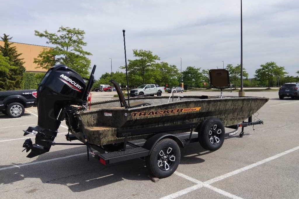 2026 Tracker Grizzly 1756 T Marsh boat on trailer in parking lot.