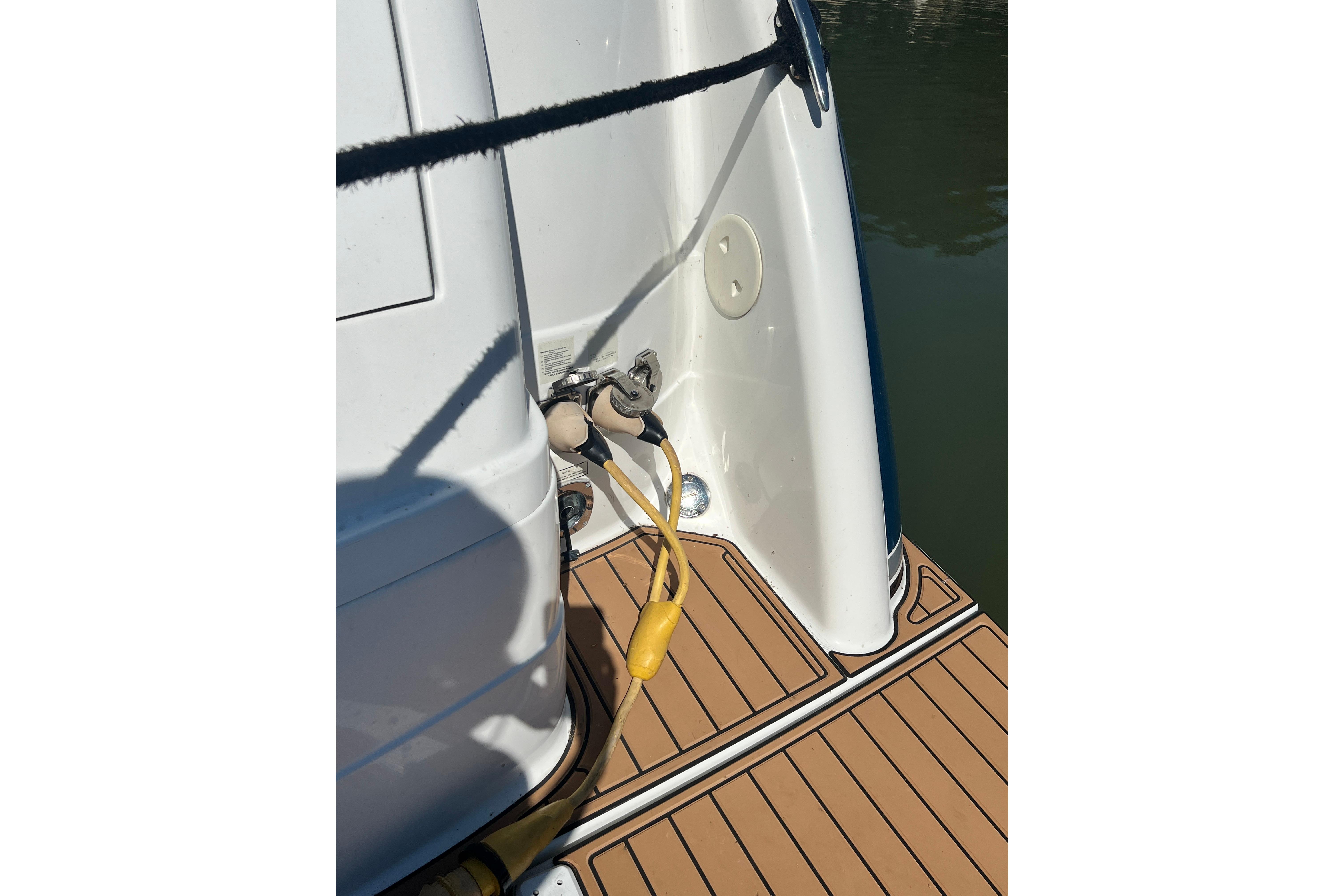 2006 Formula 40 Performance Cruiser stern with dock connections and teak deck.