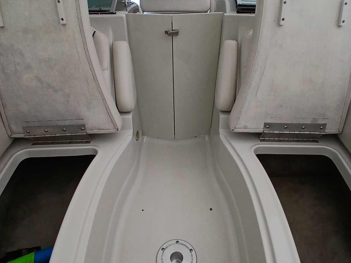 Interior of a 2005 Crownline 220 EX boat with beige seating.