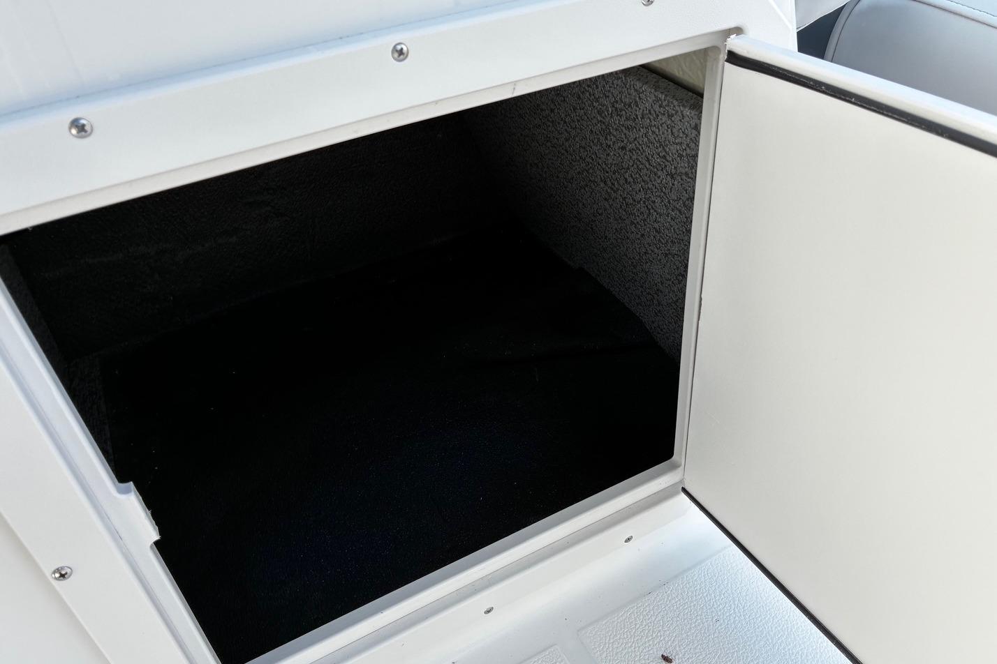Open storage compartment on 2026 Starcraft SVX 191 OB boat.