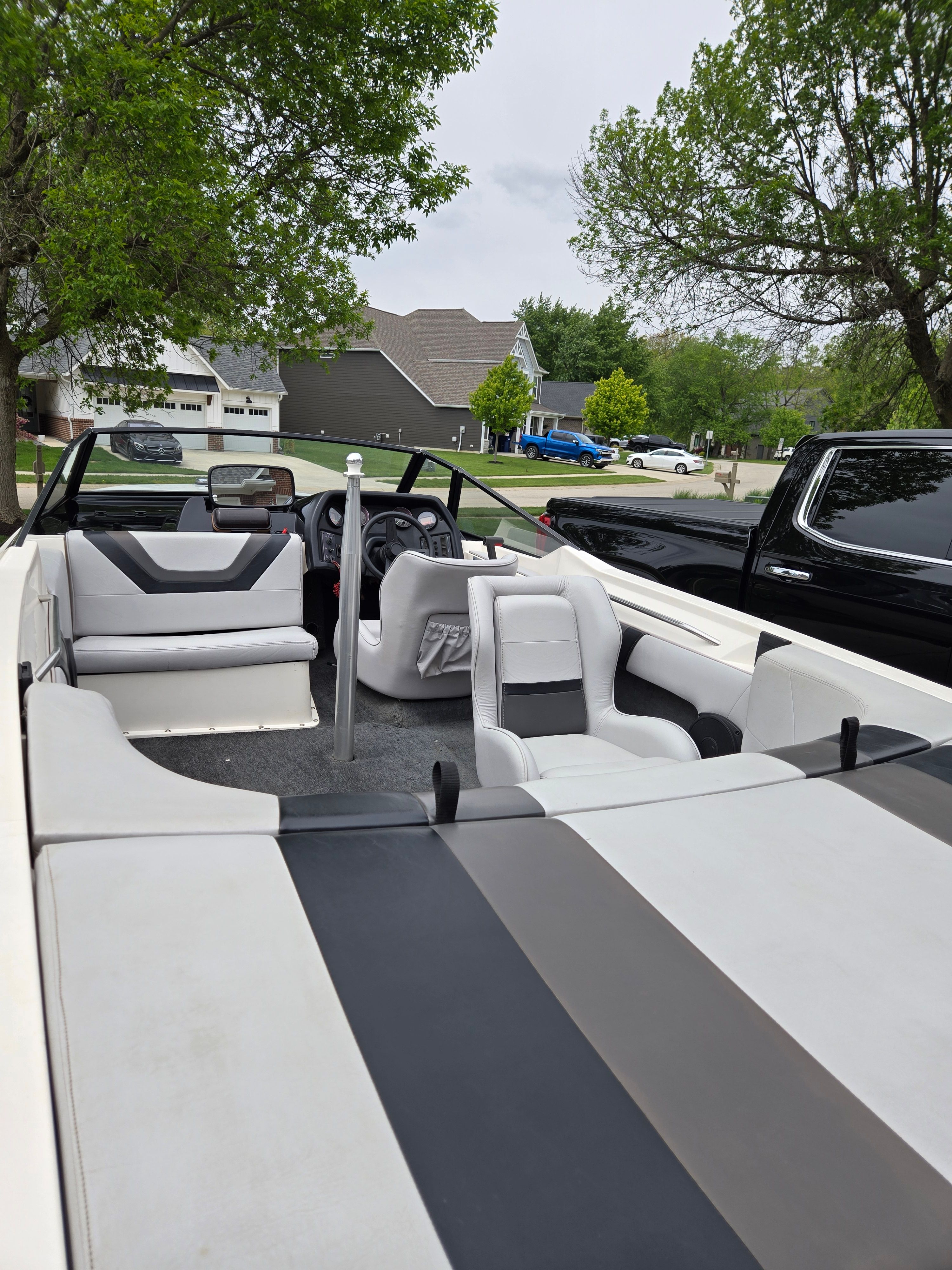 Interior view of a 1991 MasterCraft Barefoot 200 boat in a residential area.