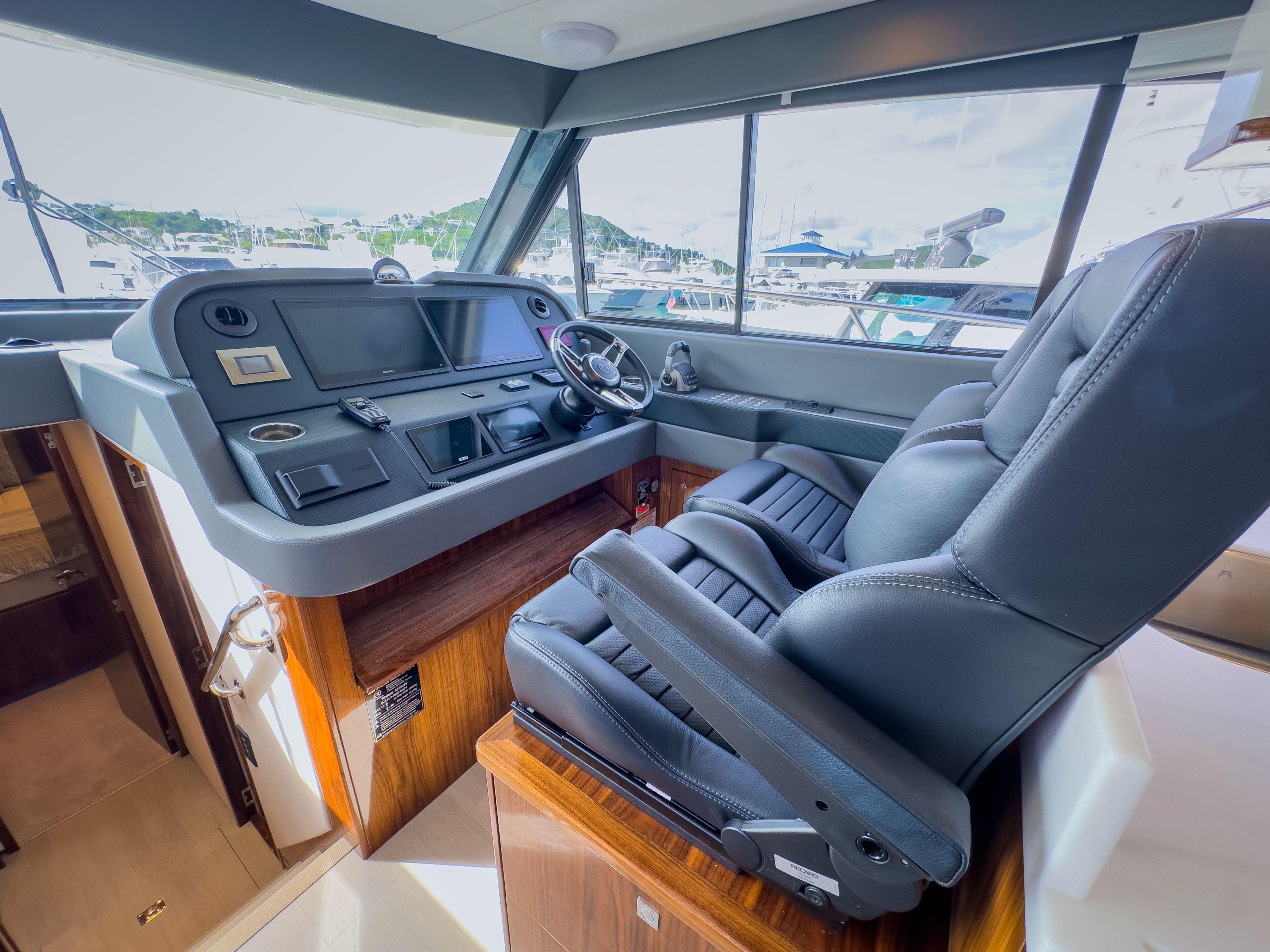 2024 Riviera 465 SUV helm with luxurious seating and modern controls.