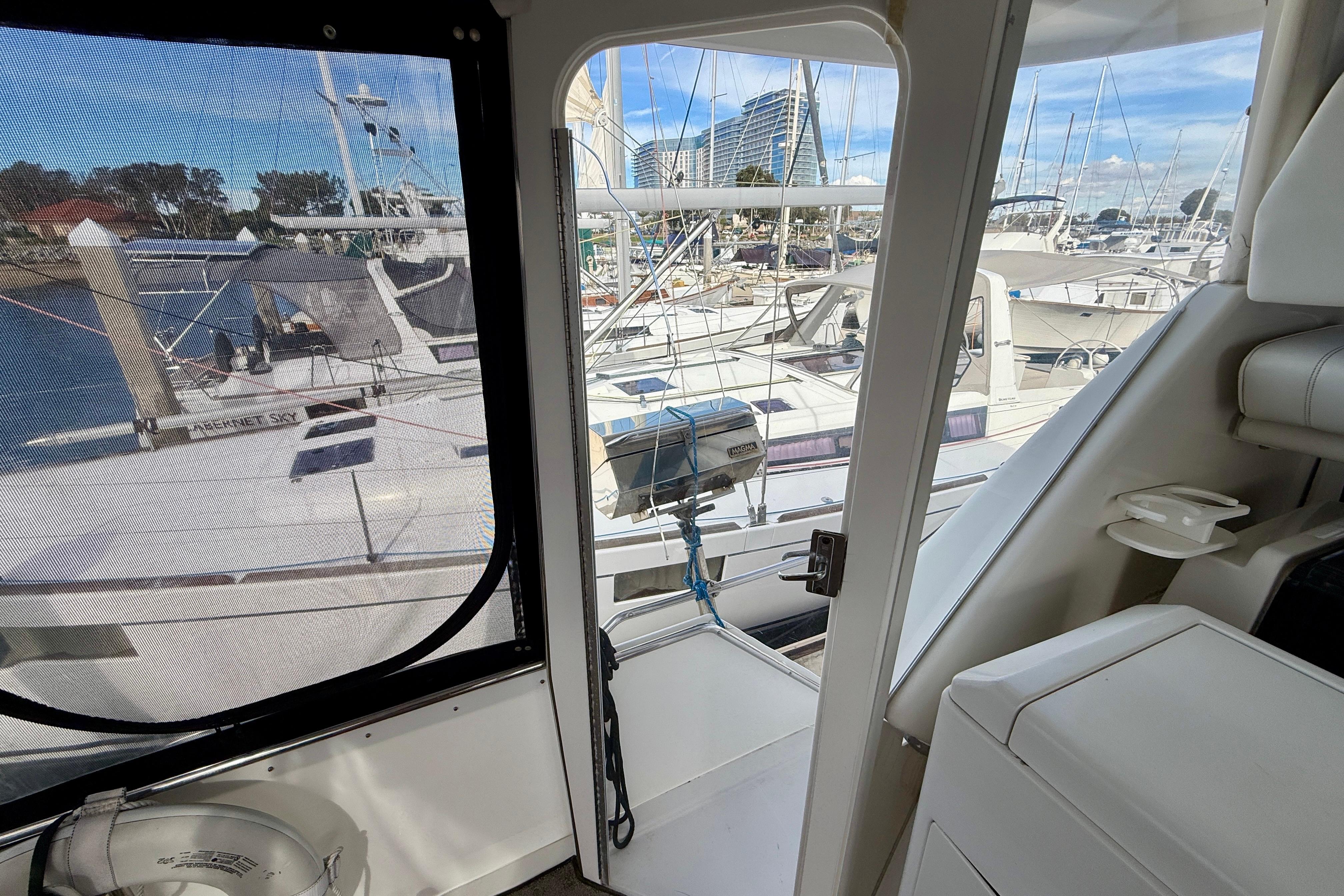 Interior view of 1997 Carver 355 Aft Cabin Motor Yacht in marina setting.