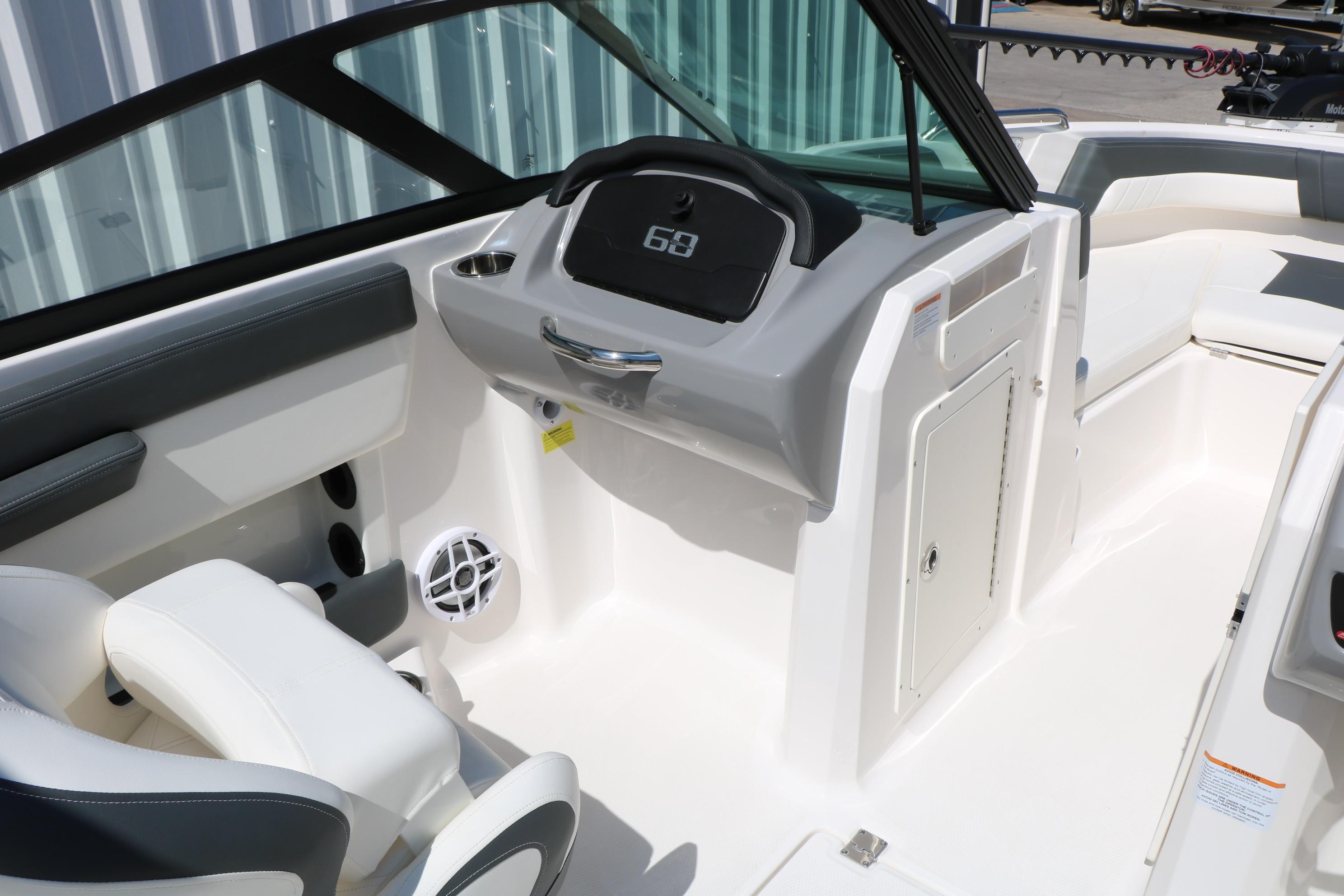 Interior view of 2025 Chaparral 21 SSi Ski & Fish boat, featuring sleek dashboard and seating.