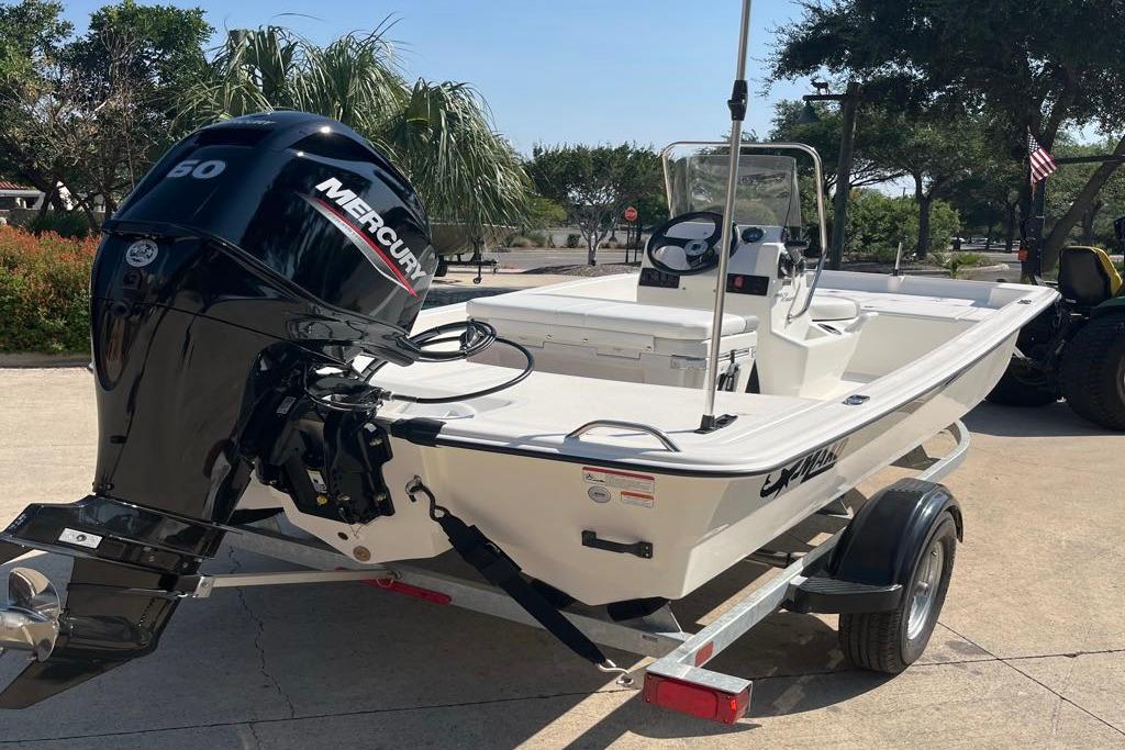 2026 Mako Pro Skiff 15 CC boat with Mercury engine on trailer.
