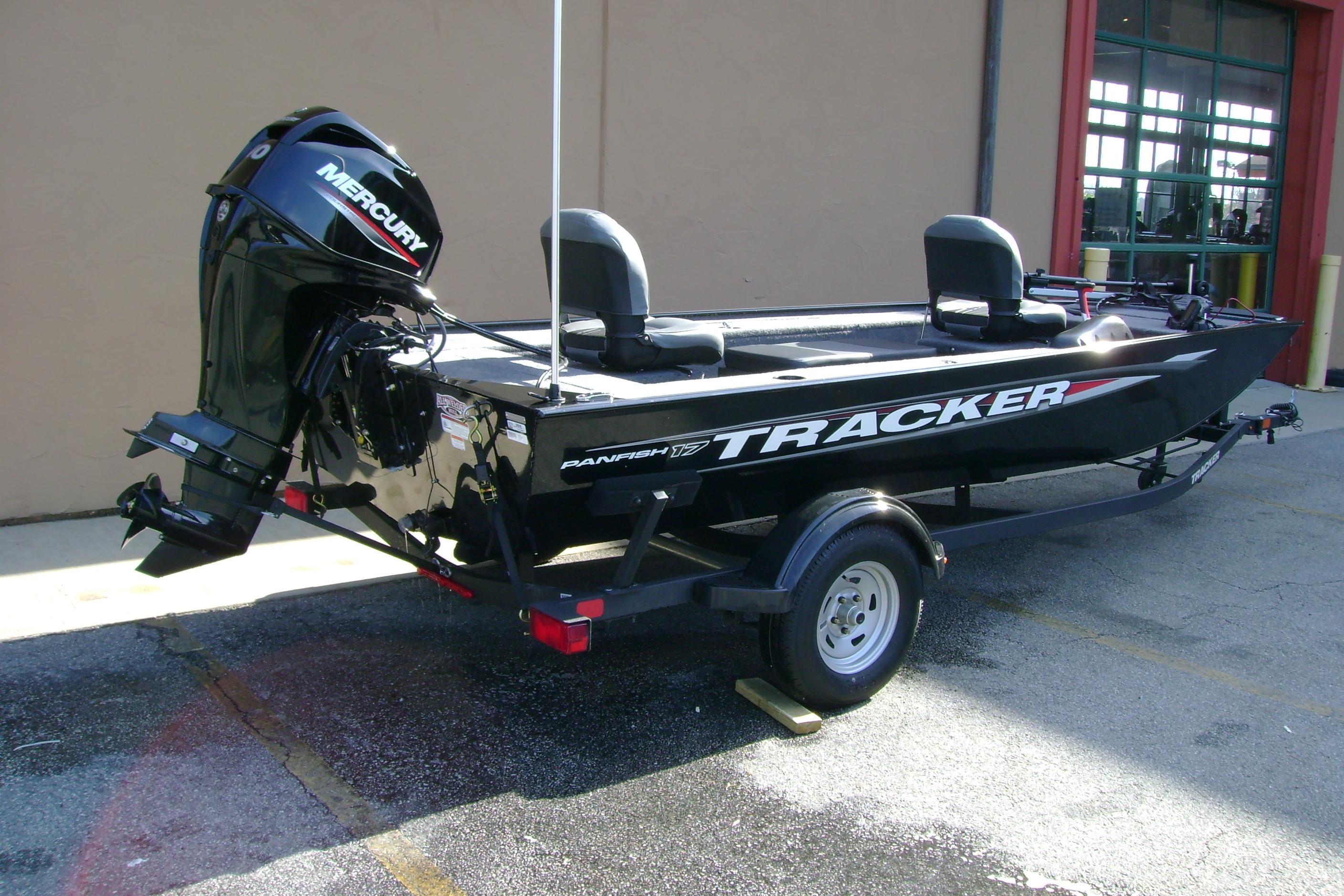 2026 Tracker Panfish 17 boat with Mercury engine on trailer, parked outdoors.