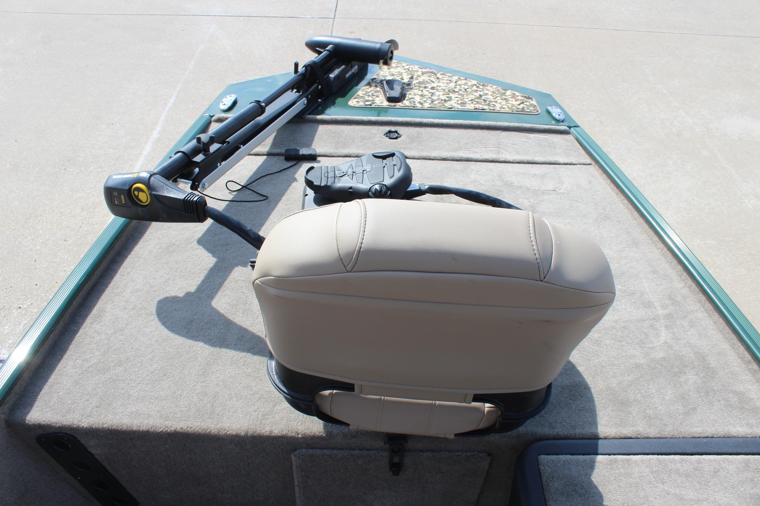 2026 Tracker Bass Tracker Classic Limited boat deck with seat and trolling motor.