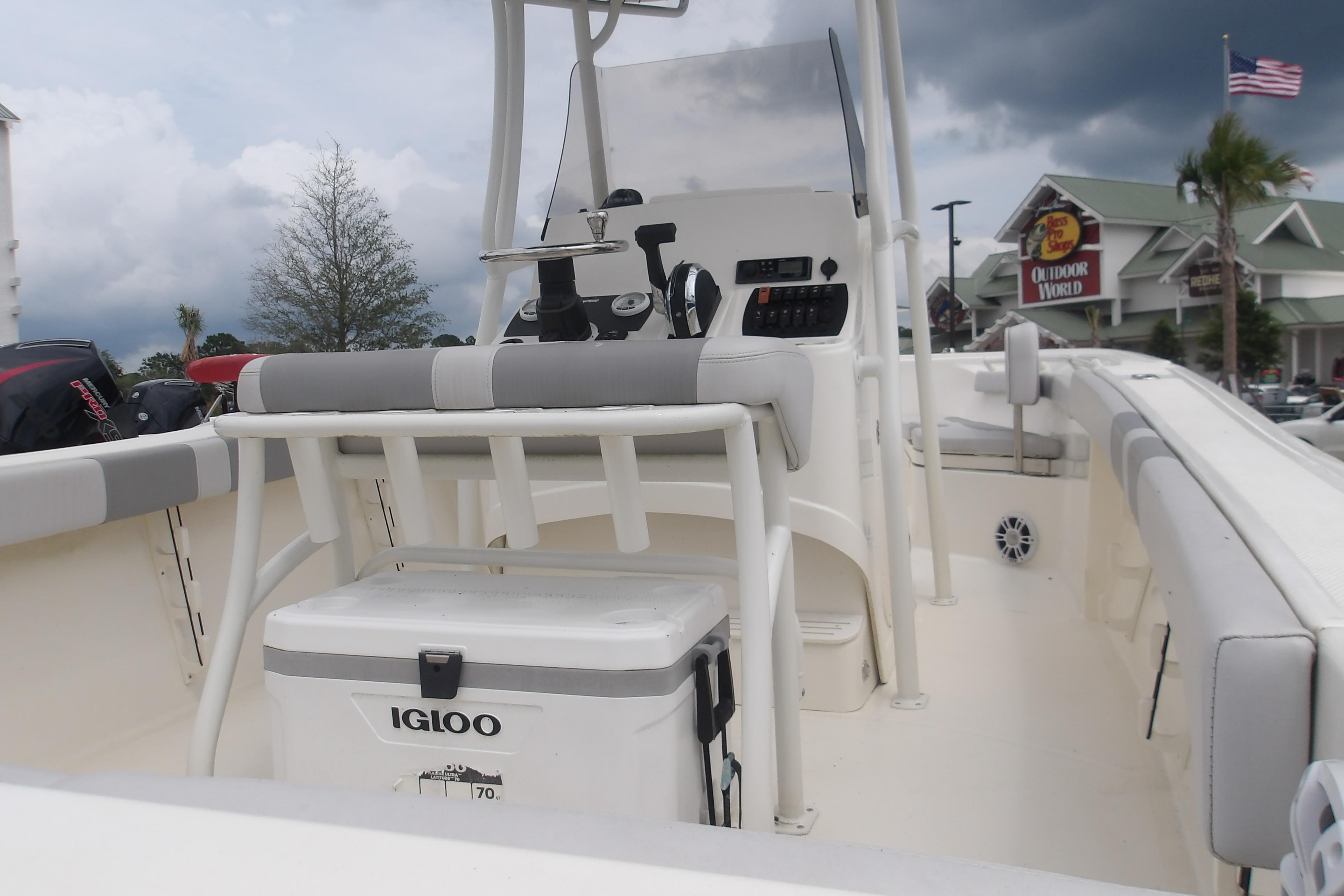 2025 Mako 214 Center Console boat interior with Igloo cooler and control panel.