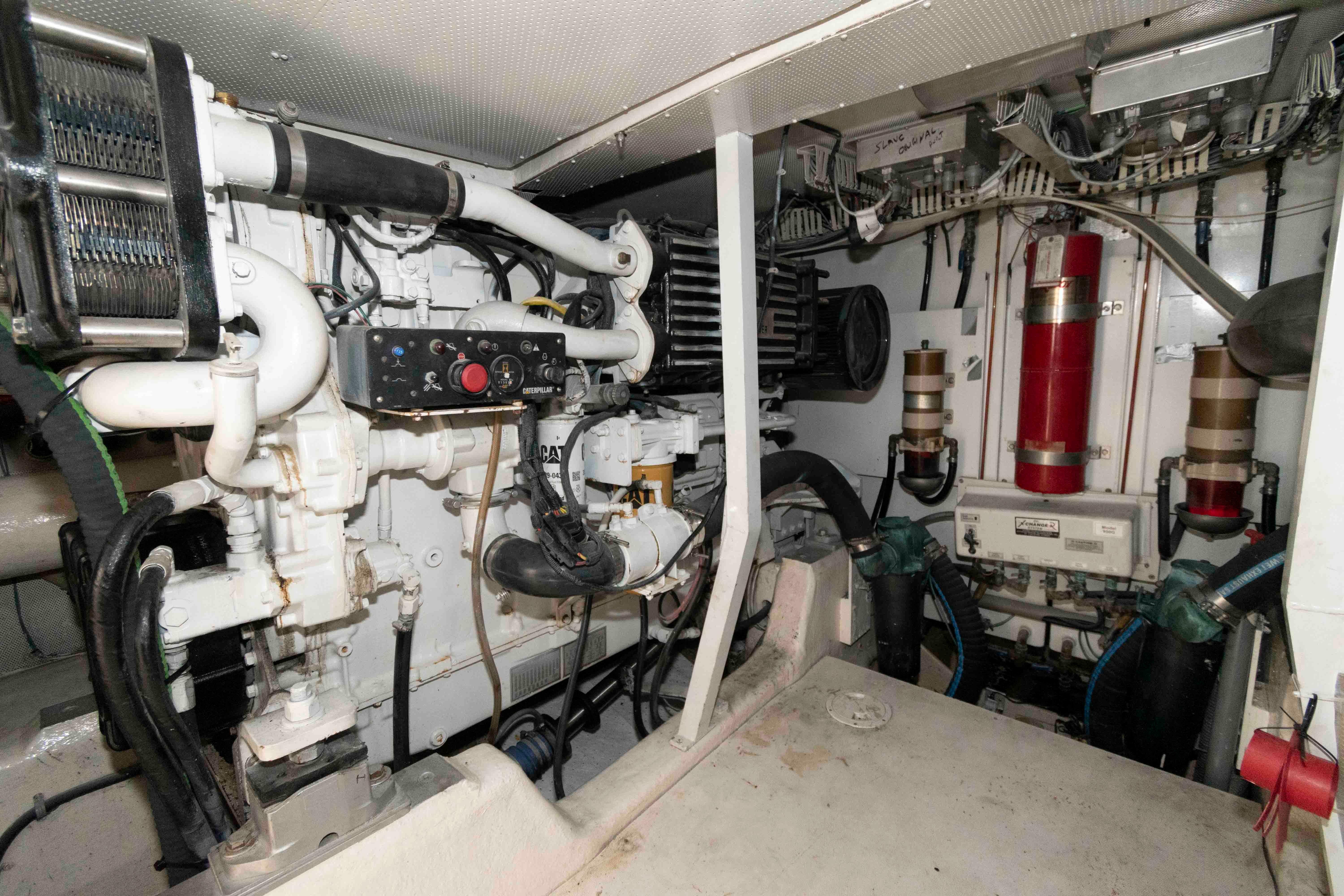 Engine room of 2003 Neptunus 56 Flybridge yacht, showcasing mechanical components and systems.