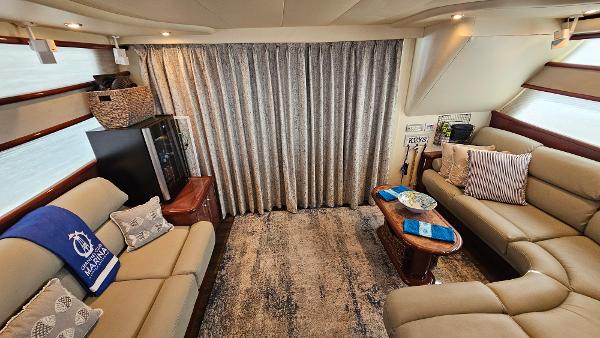 Luxurious interior of 2005 Neptunus 56 Flybridge yacht with elegant seating and decor.