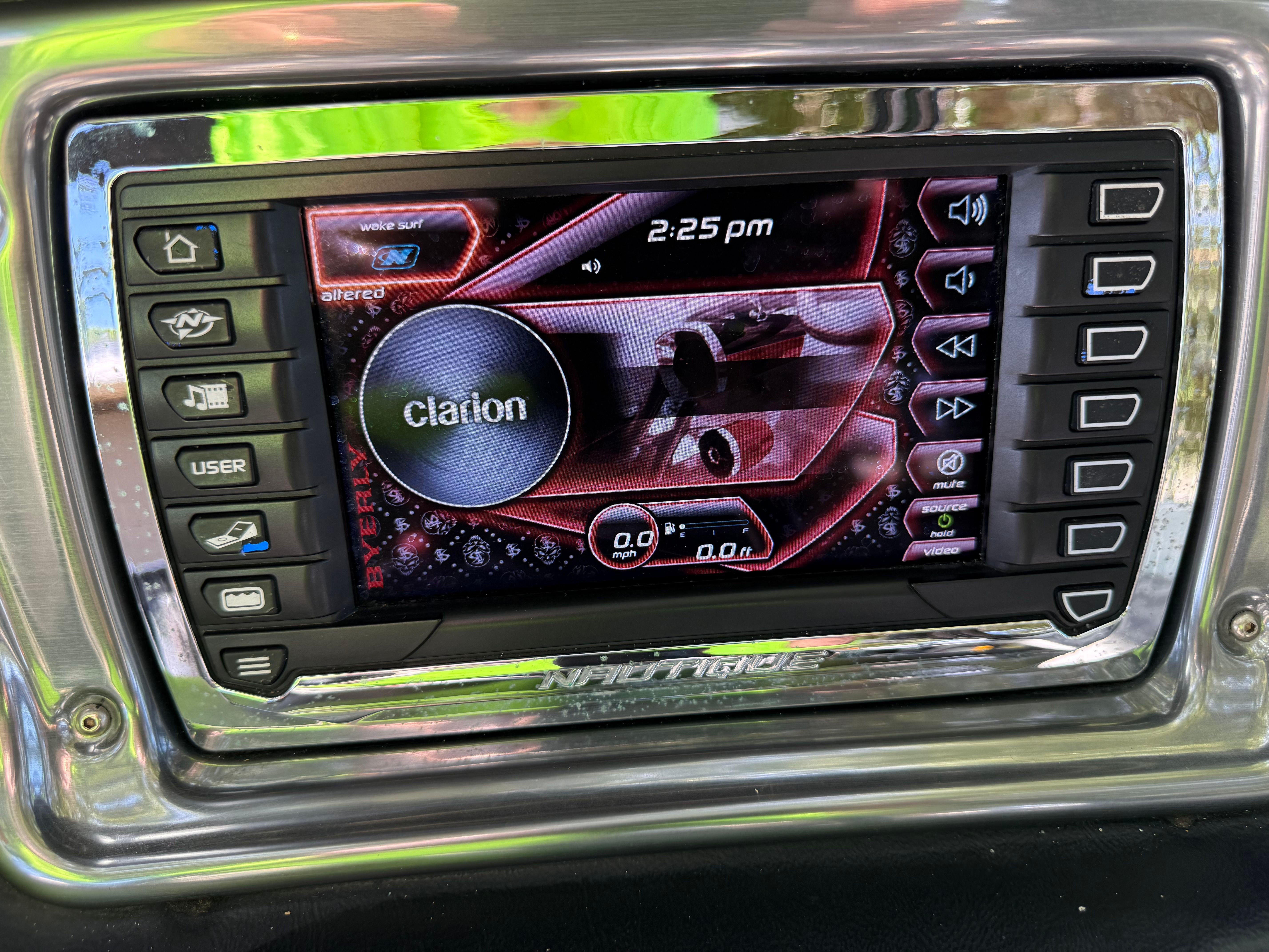 2012 Nautique Super Air Nautique 210 control panel with Clarion display.