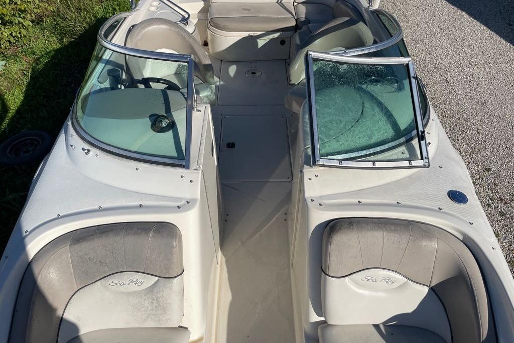 2004 Sea Ray 240 Sundeck boat interior with seating and windshield.