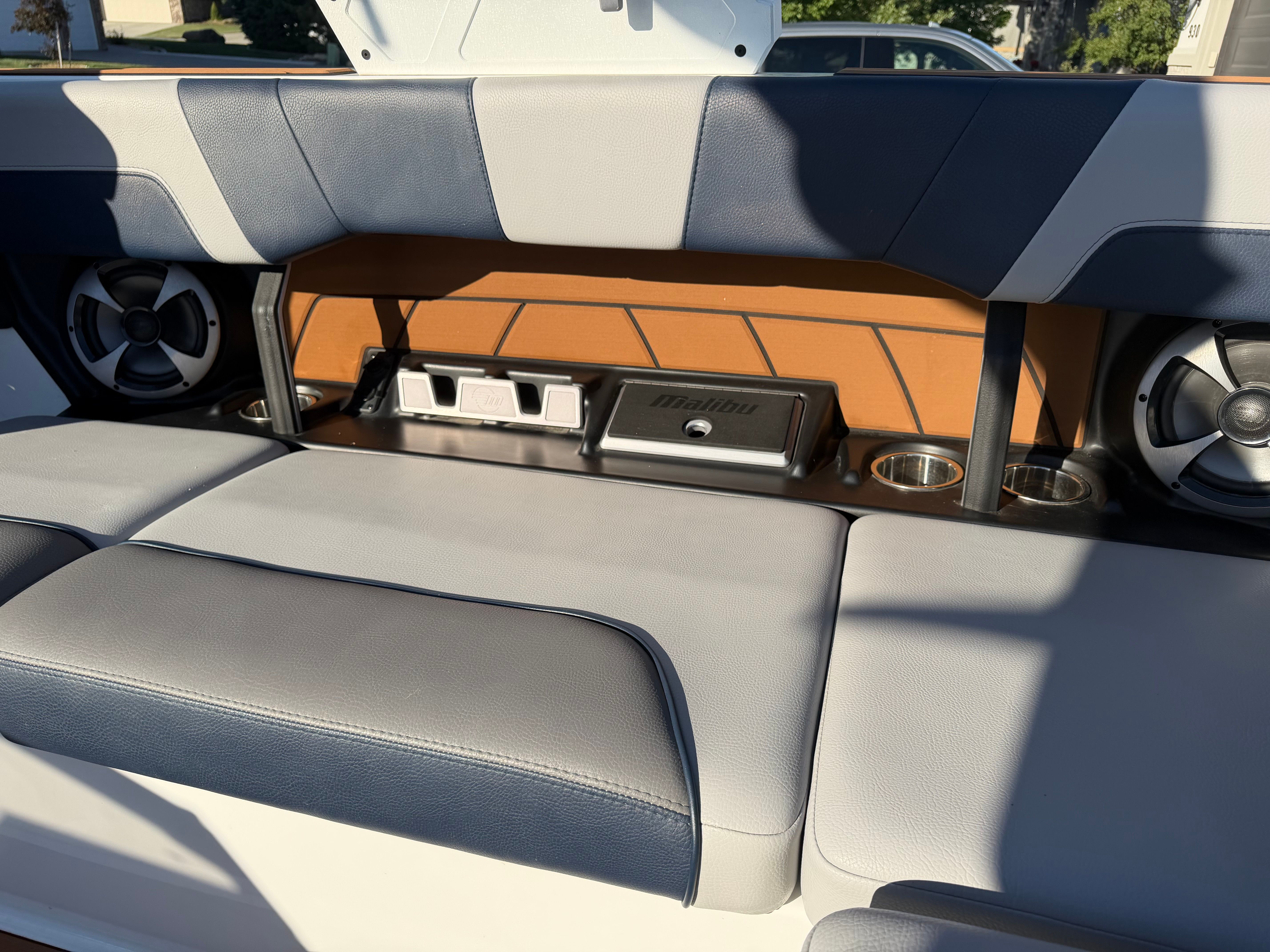 The image shows the interior of a 2021 Malibu Wakesetter 23 LSV with speakers and cup holders.