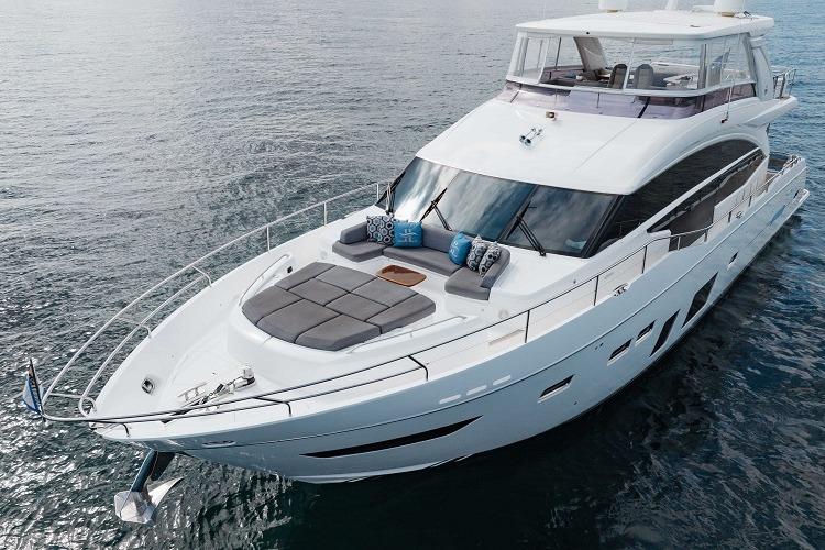 2017 Princess 75 Motor Yacht cruising on calm waters, featuring luxurious deck seating.