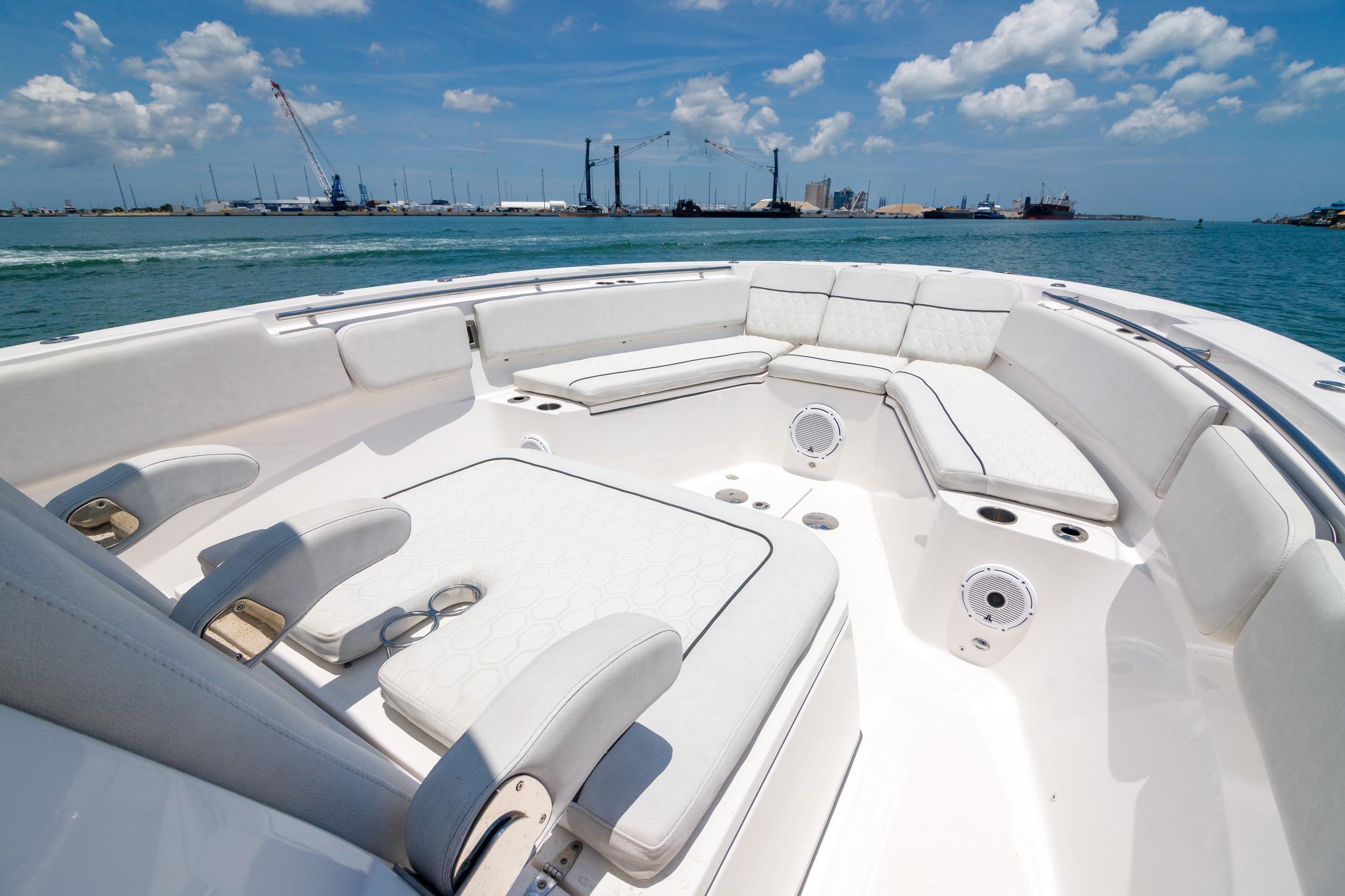 Luxurious seating area on 2021 Sea Fox 328 Commander boat under clear blue sky.
