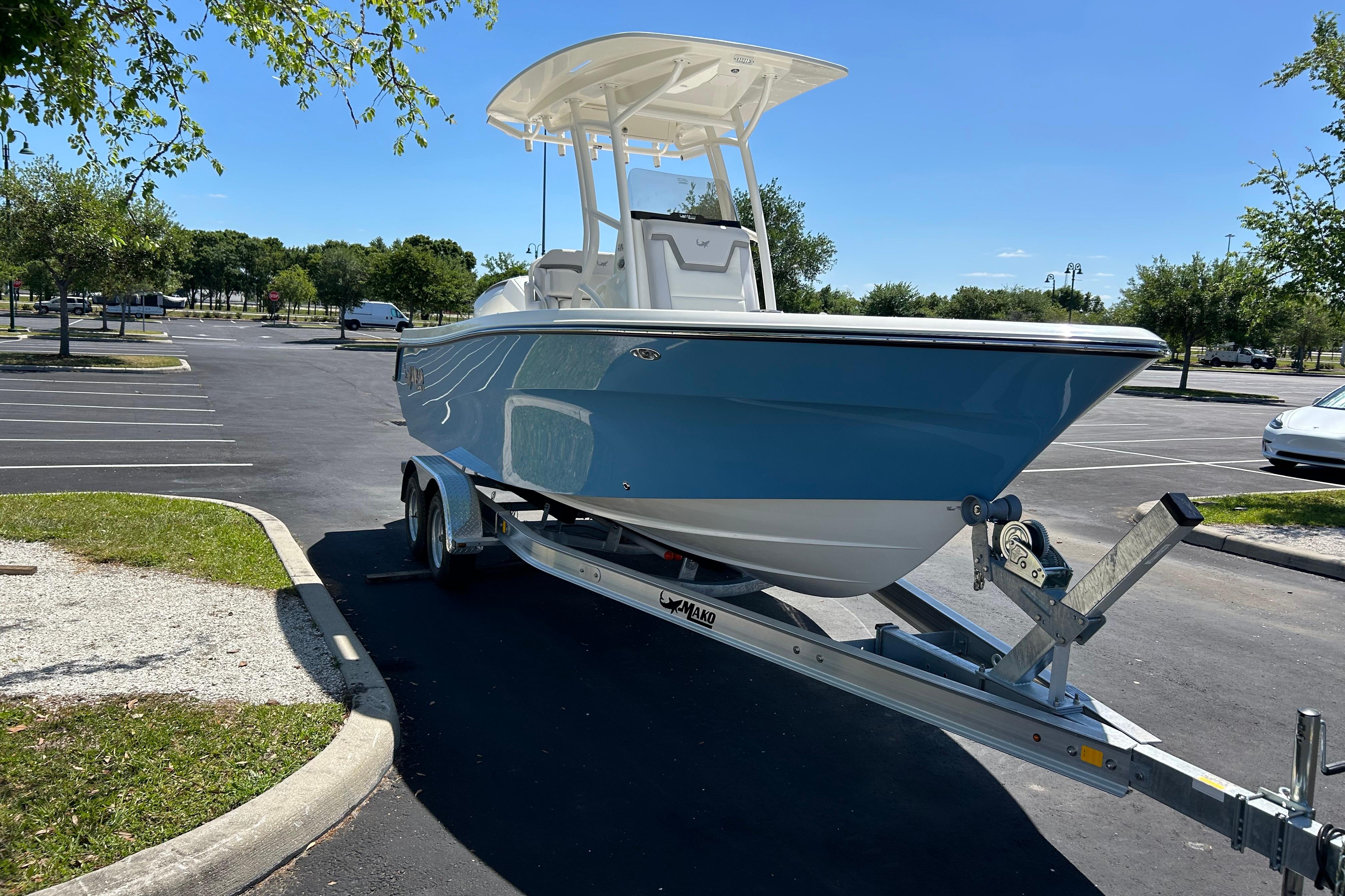 2026 Mako 226 Center Console boat on trailer in parking lot.
