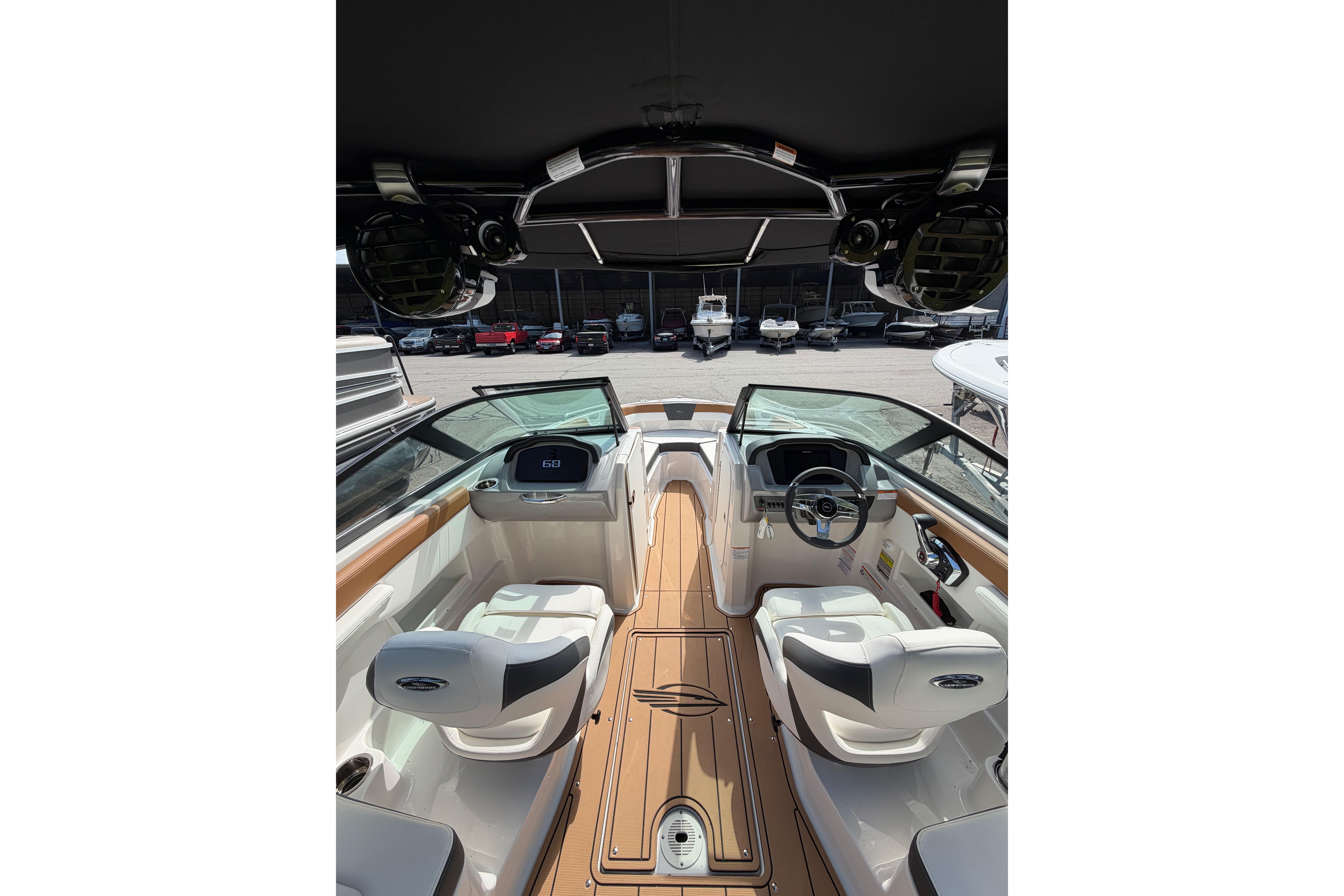Interior view of 2025 Chaparral 230 SSi boat with modern seating and dashboard.