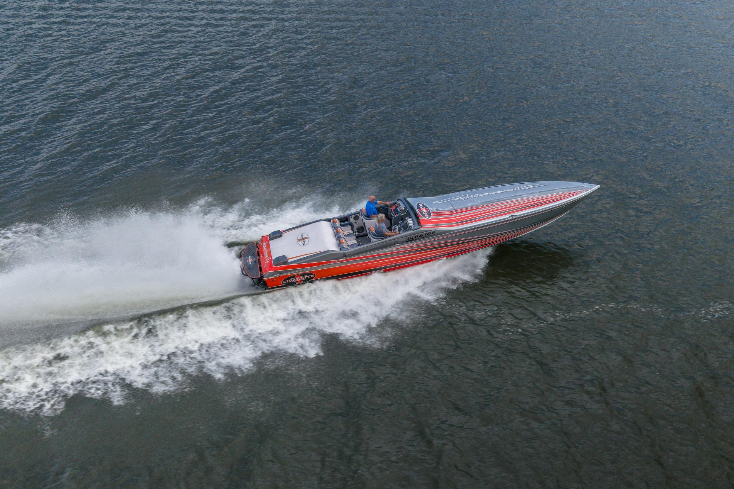 2006 Cigarette 39' Top Gun speedboat cruising on open water, showcasing sleek design and performance.