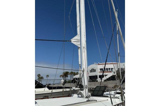 1982 Lancer 45 Motorsailer mast and rigging against clear blue sky.