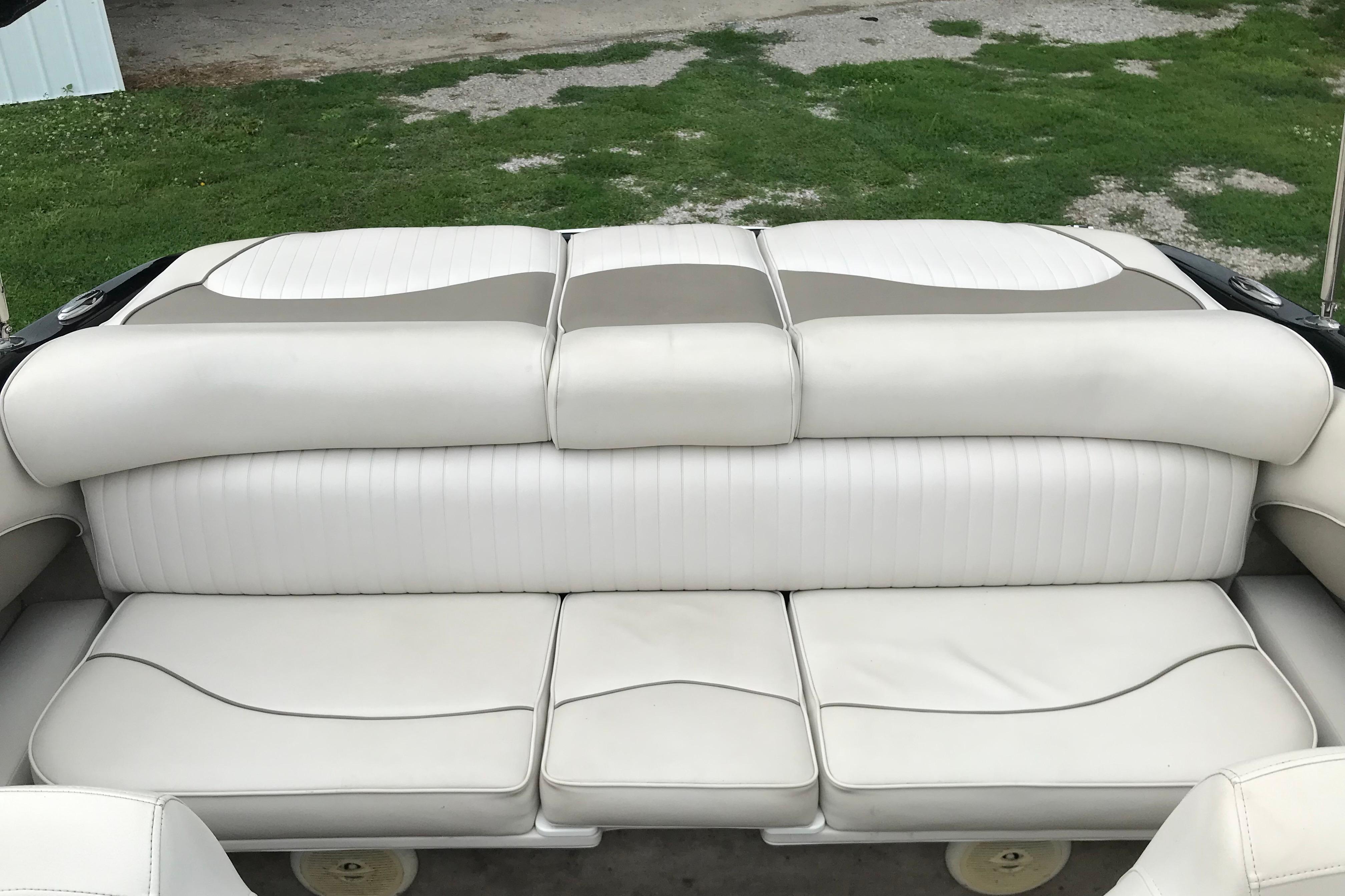2015 Crownline 18 SS boat interior with white cushioned seating.