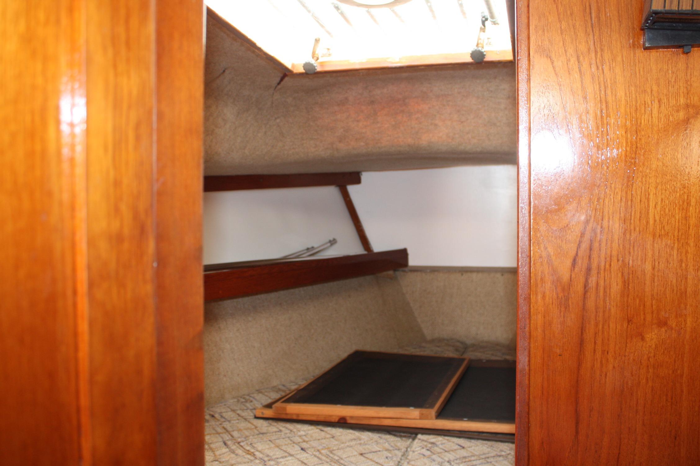 Interior cabin view of 1981 S2 9.2A sailboat with wooden finish and storage space.