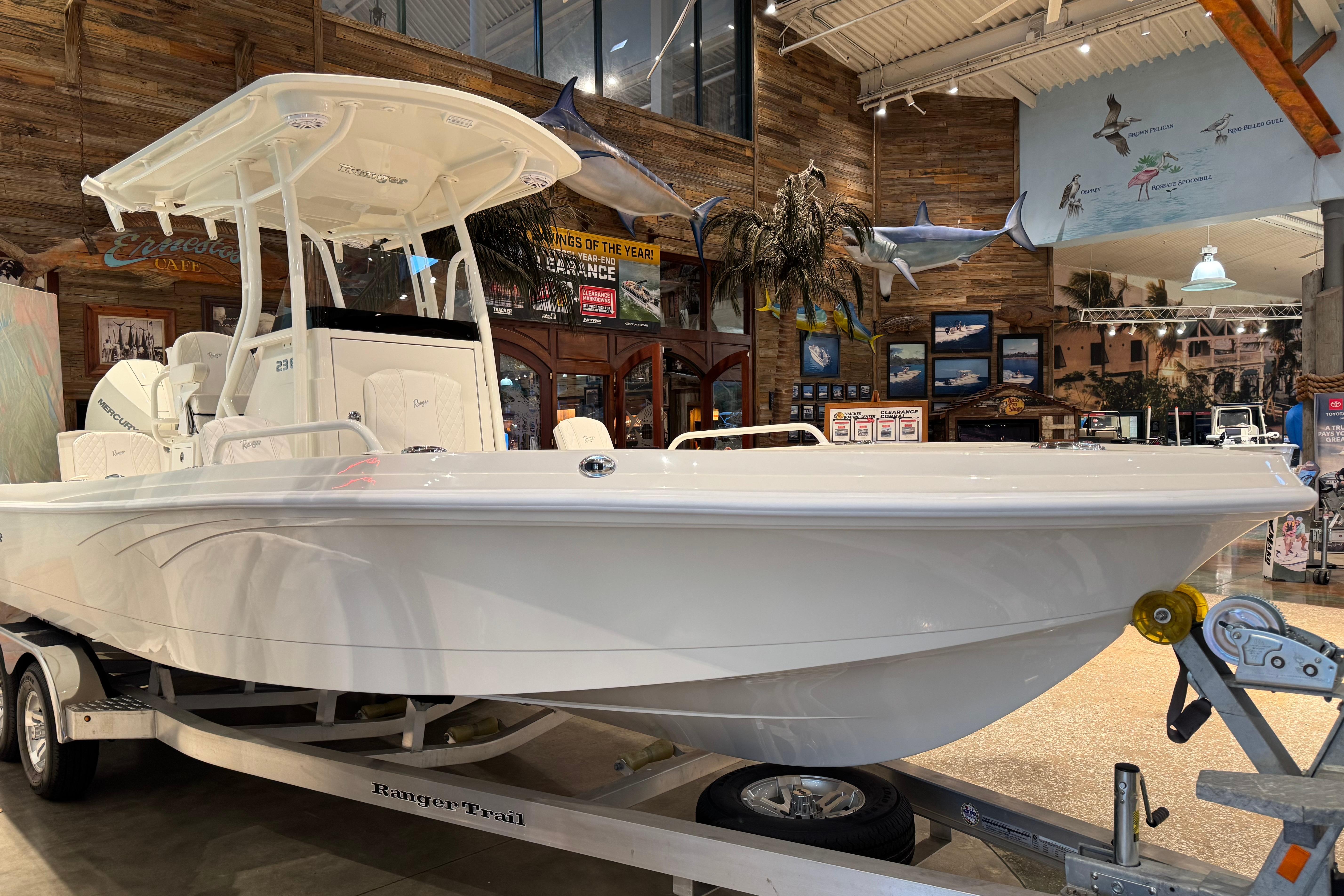 2025 Ranger 2360 Bay boat displayed indoors on a trailer.