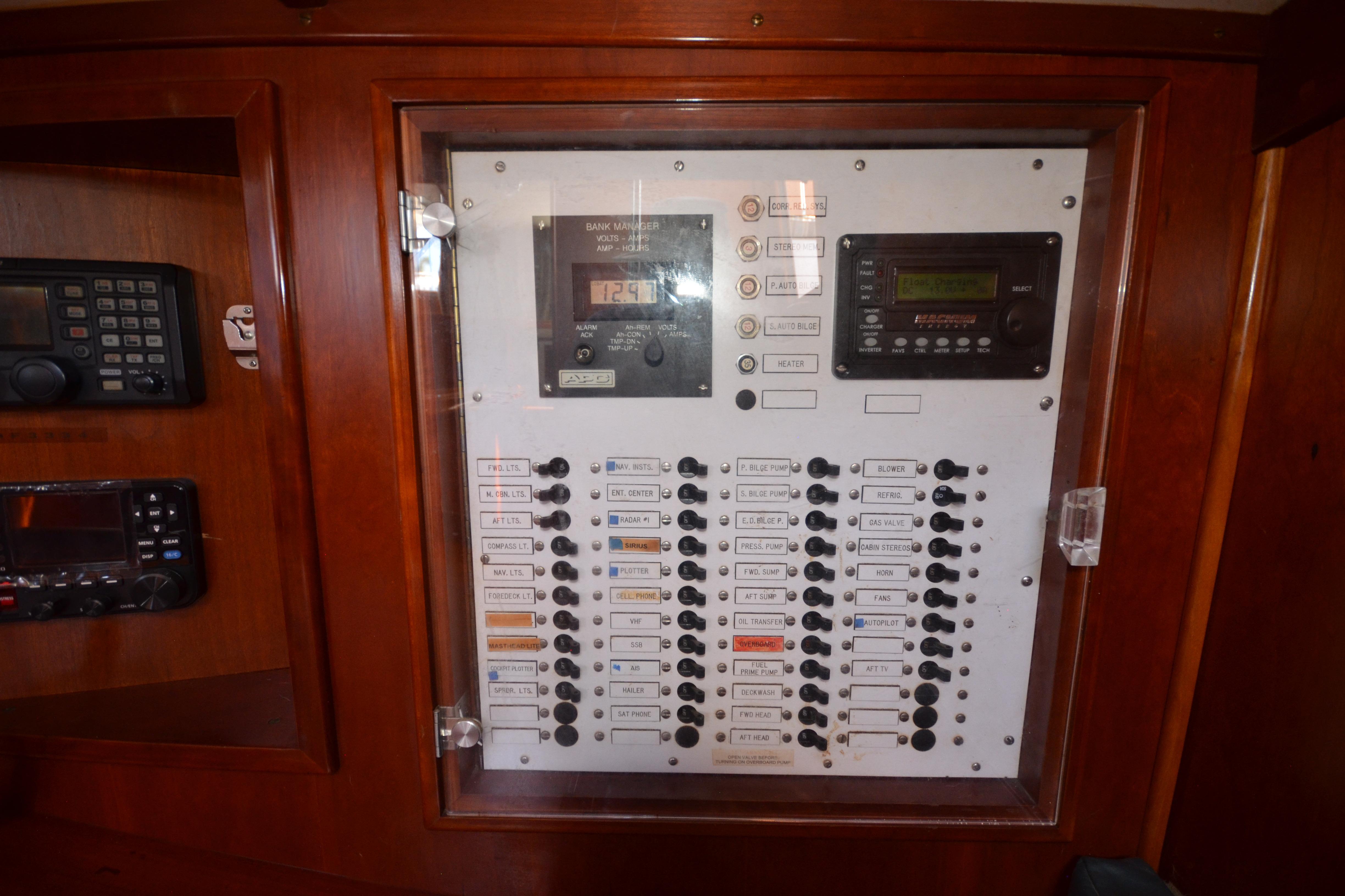 Electrical control panel on 1992 Hinckley Sou'wester 59 yacht, featuring switches and displays.
