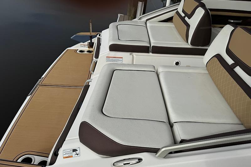 2023 Yamaha 275SDX boat interior with cushioned seating and sleek design.